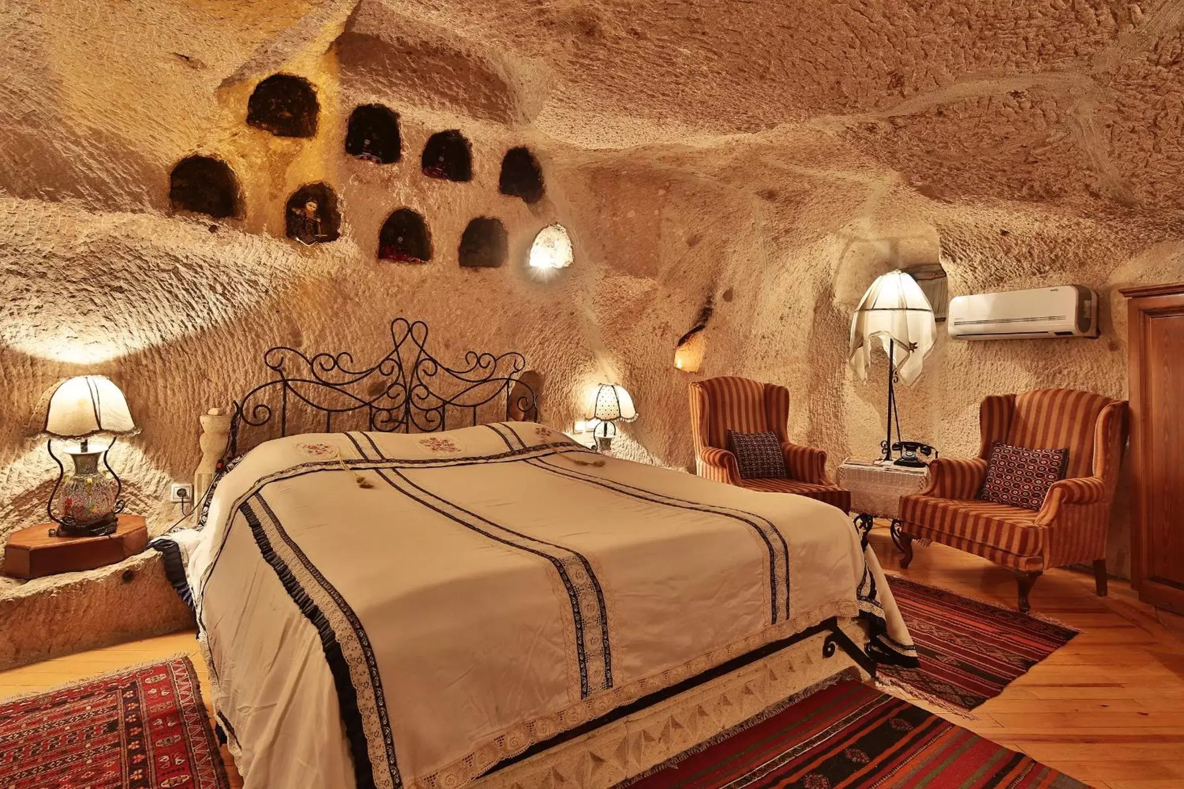 Seating area, Bed in Cappadocia Cave Suites