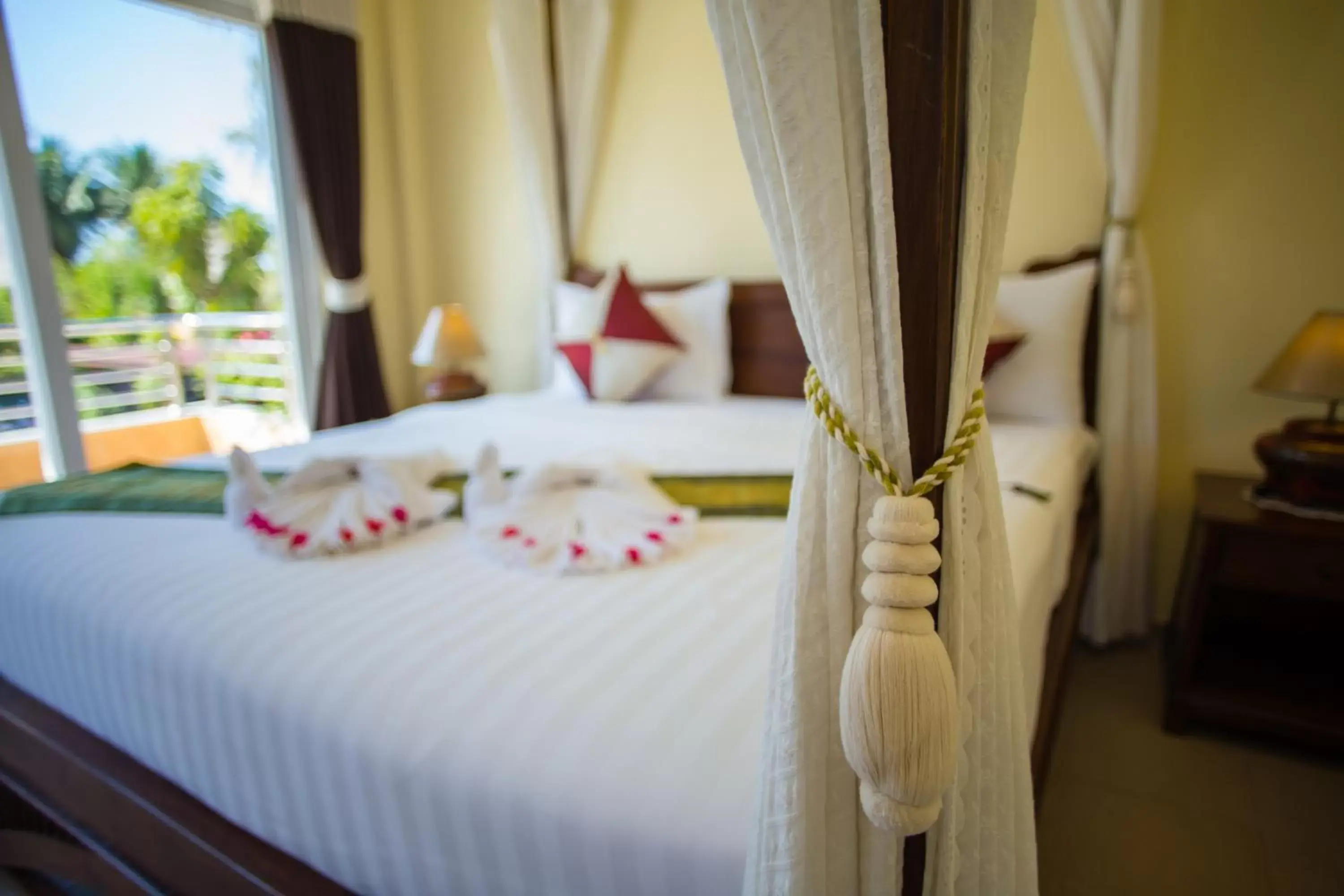 Bed in Little Sunshine Boutique Beach Resort & Spa