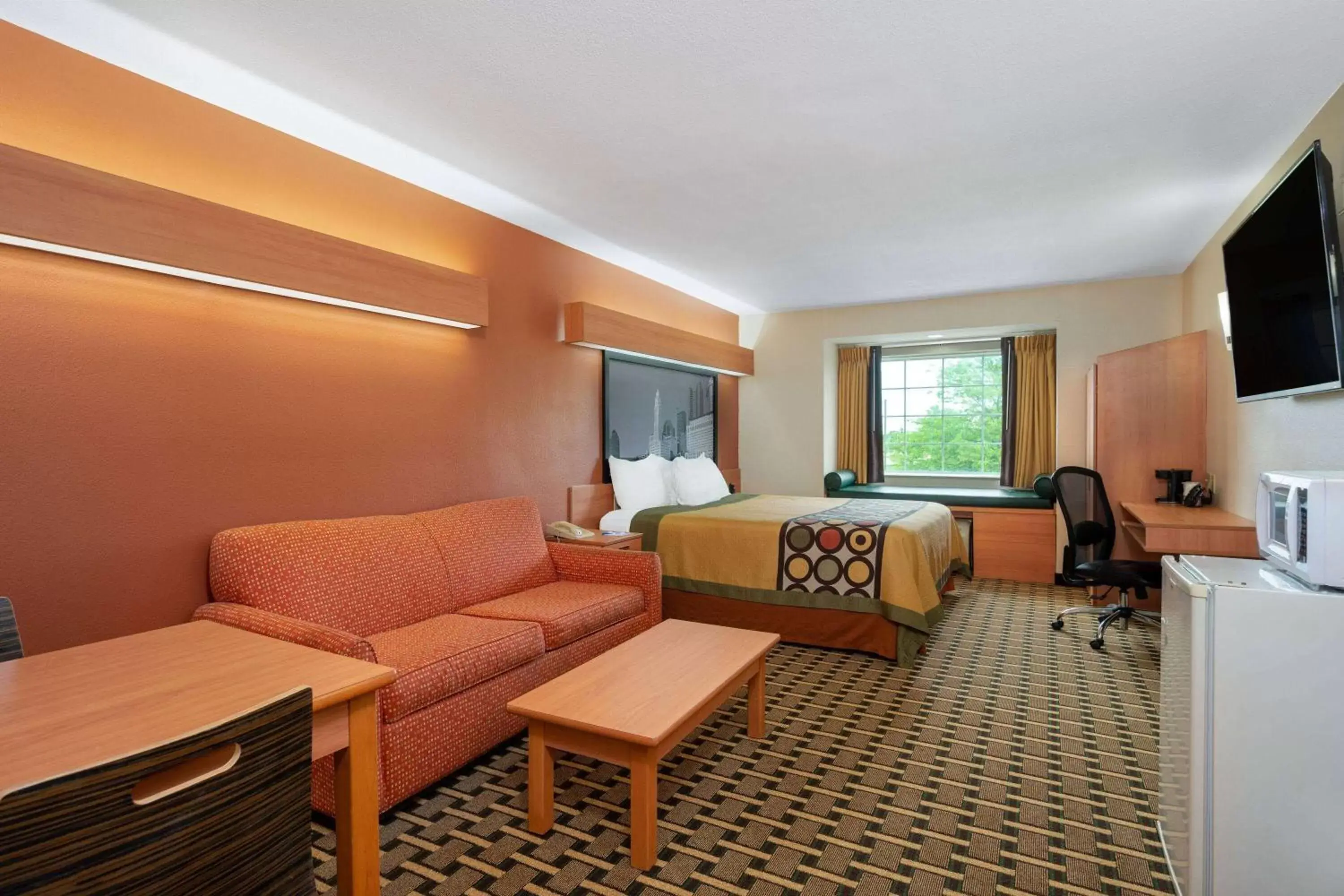 Bed, Seating Area in Super 8 by Wyndham Columbus West