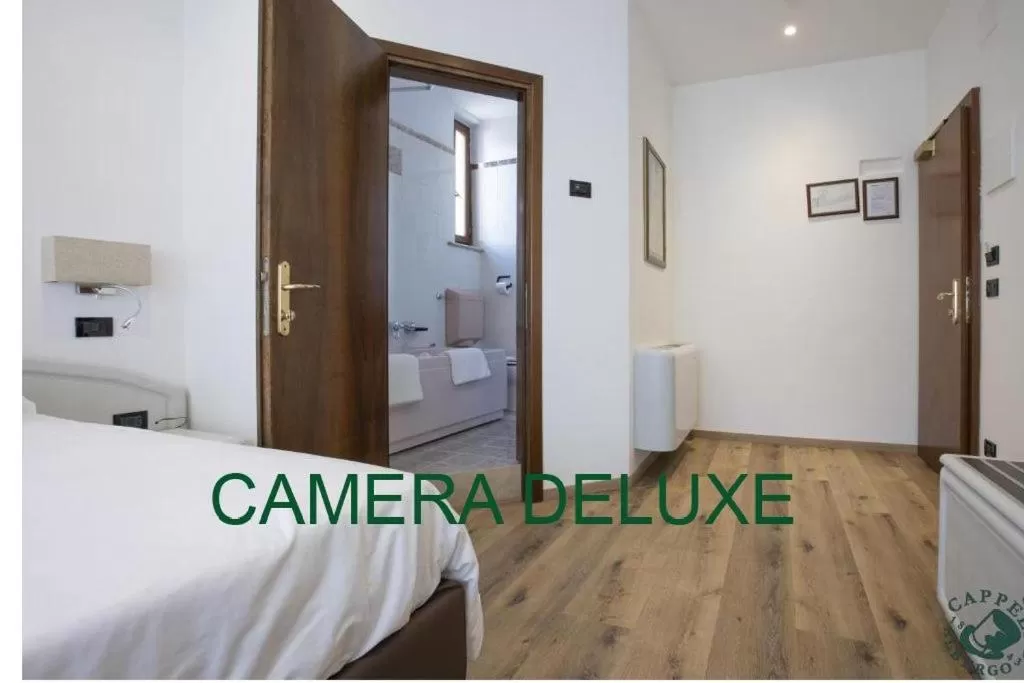 Bed in Albergo Cappello e Cadore