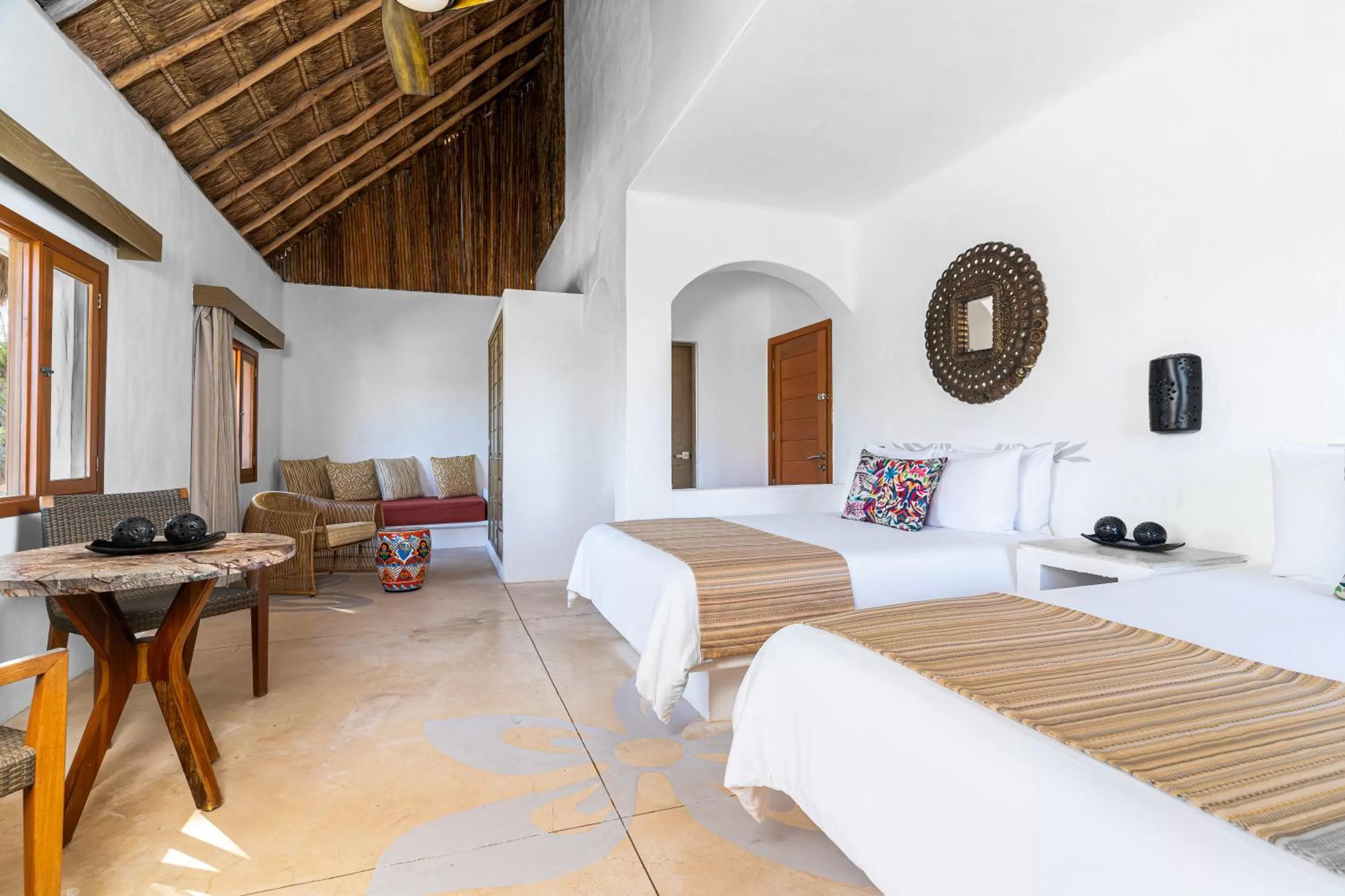 Bed in Mahekal Beach Front Resort & Spa