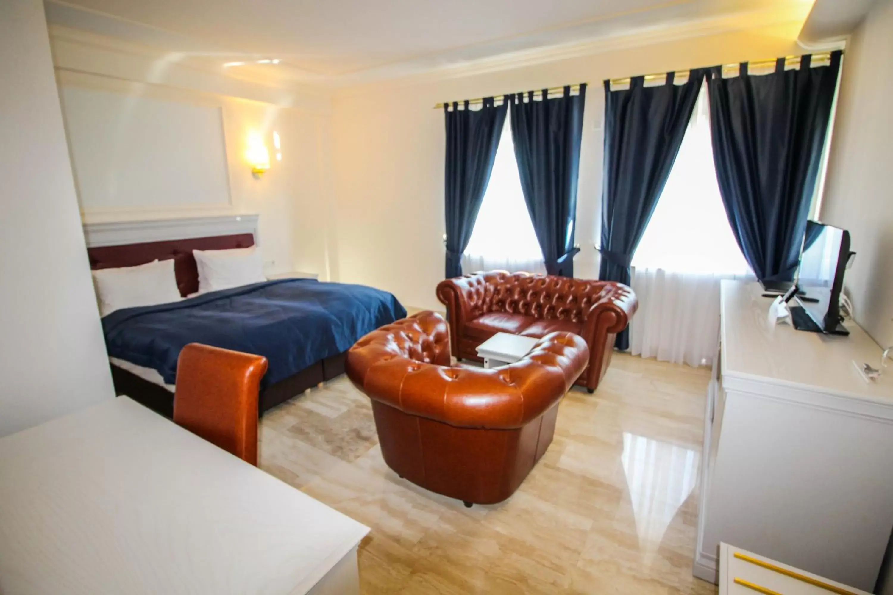 Bed, Seating Area in Grand Hotel Palladium