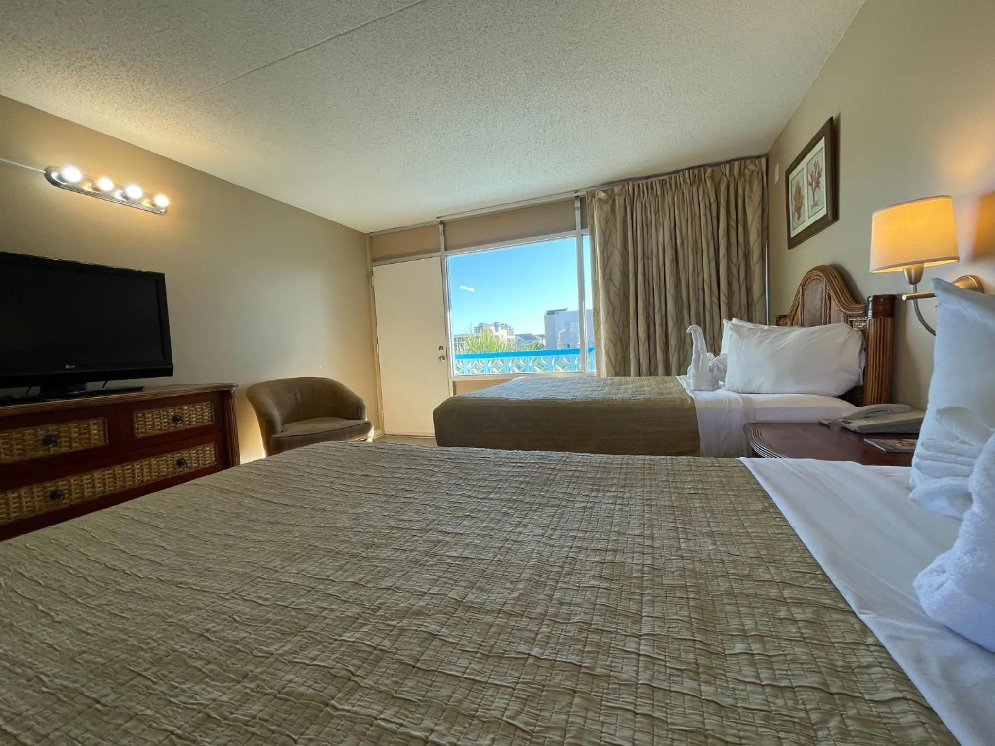 Bed in Polynesian Oceanfront Hotel