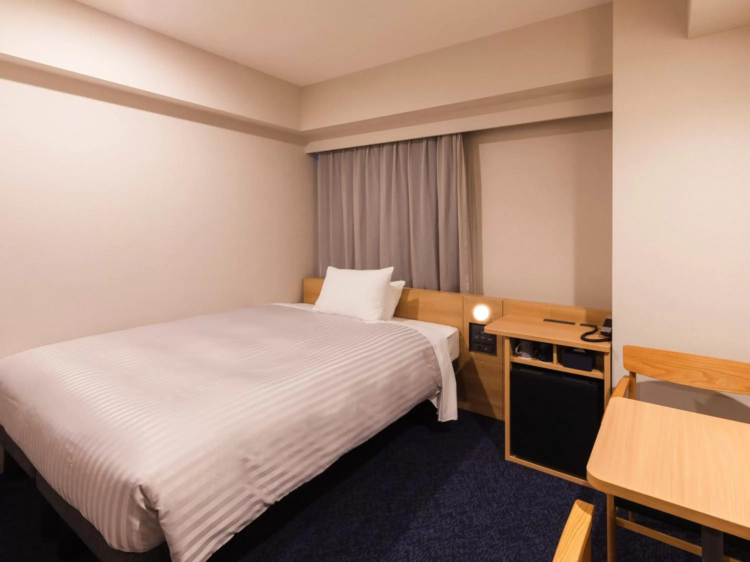 Photo of the whole room, Bed in Sotetsu Fresa Inn Nagoya-Shinkansenguchi