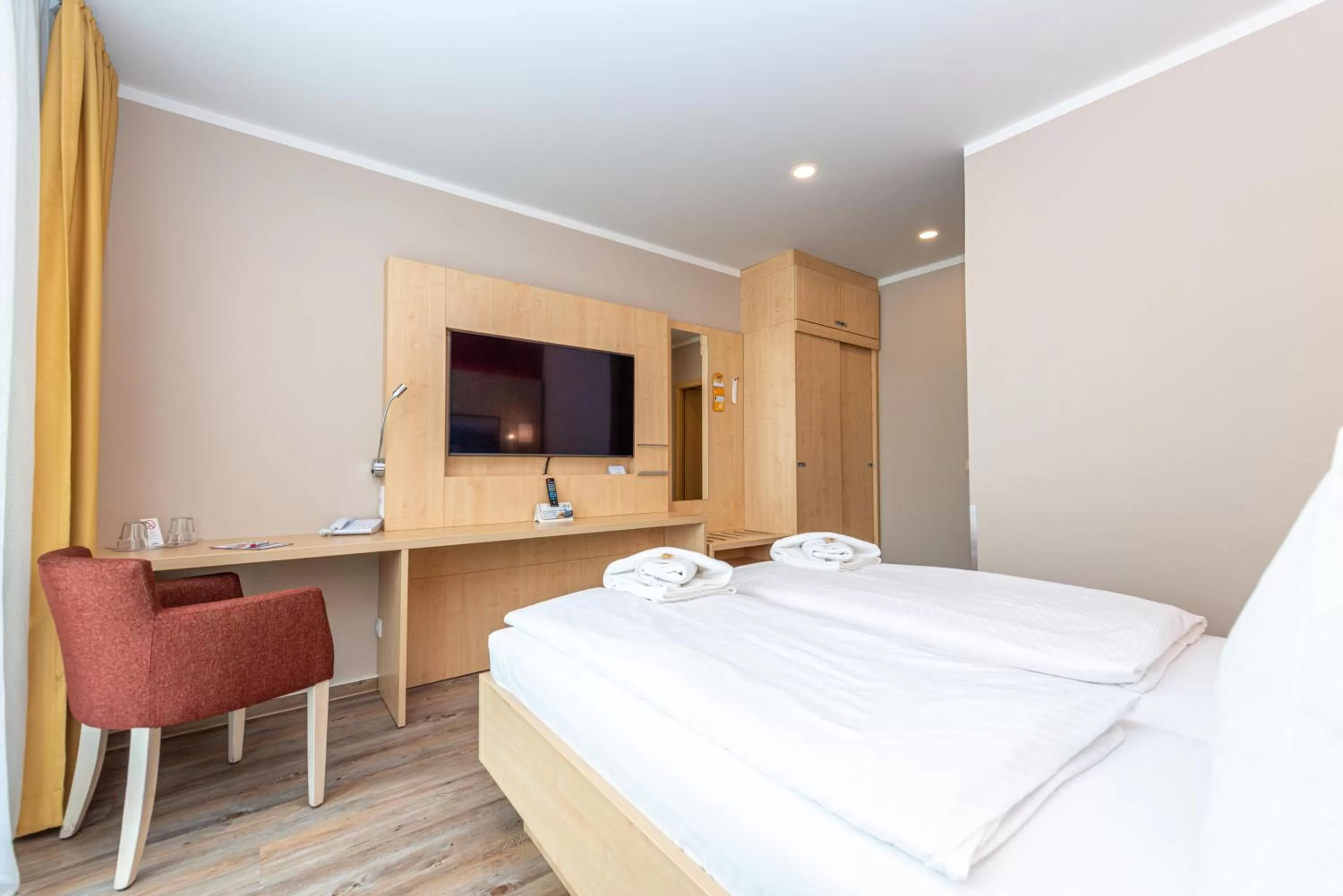 Bed in Hotel an der Stadthalle Rostock