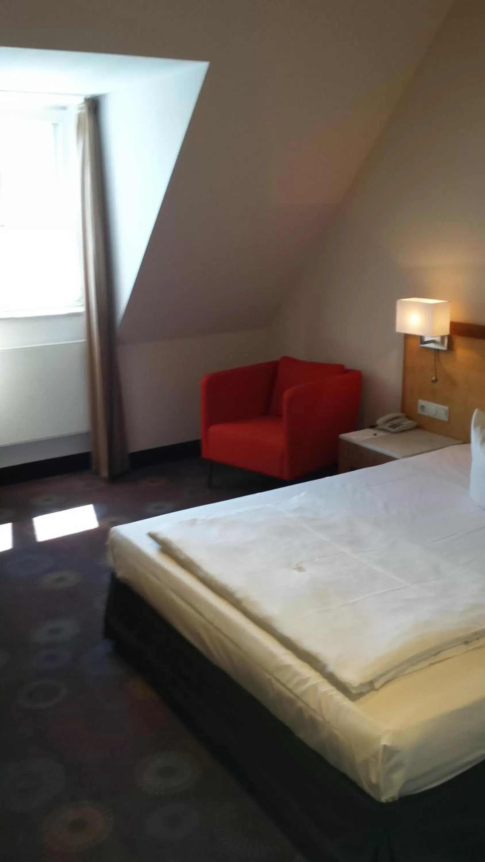 Photo of the whole room, Bed in SORAT Insel-Hotel Regensburg