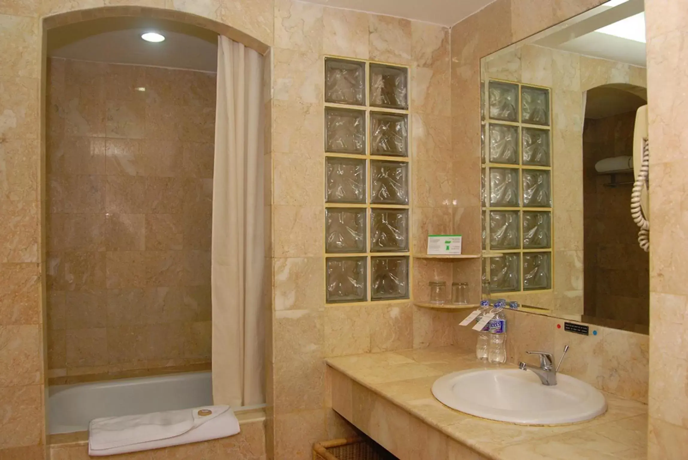 Bathroom in Surabaya Suites Hotel Powered by Archipelago