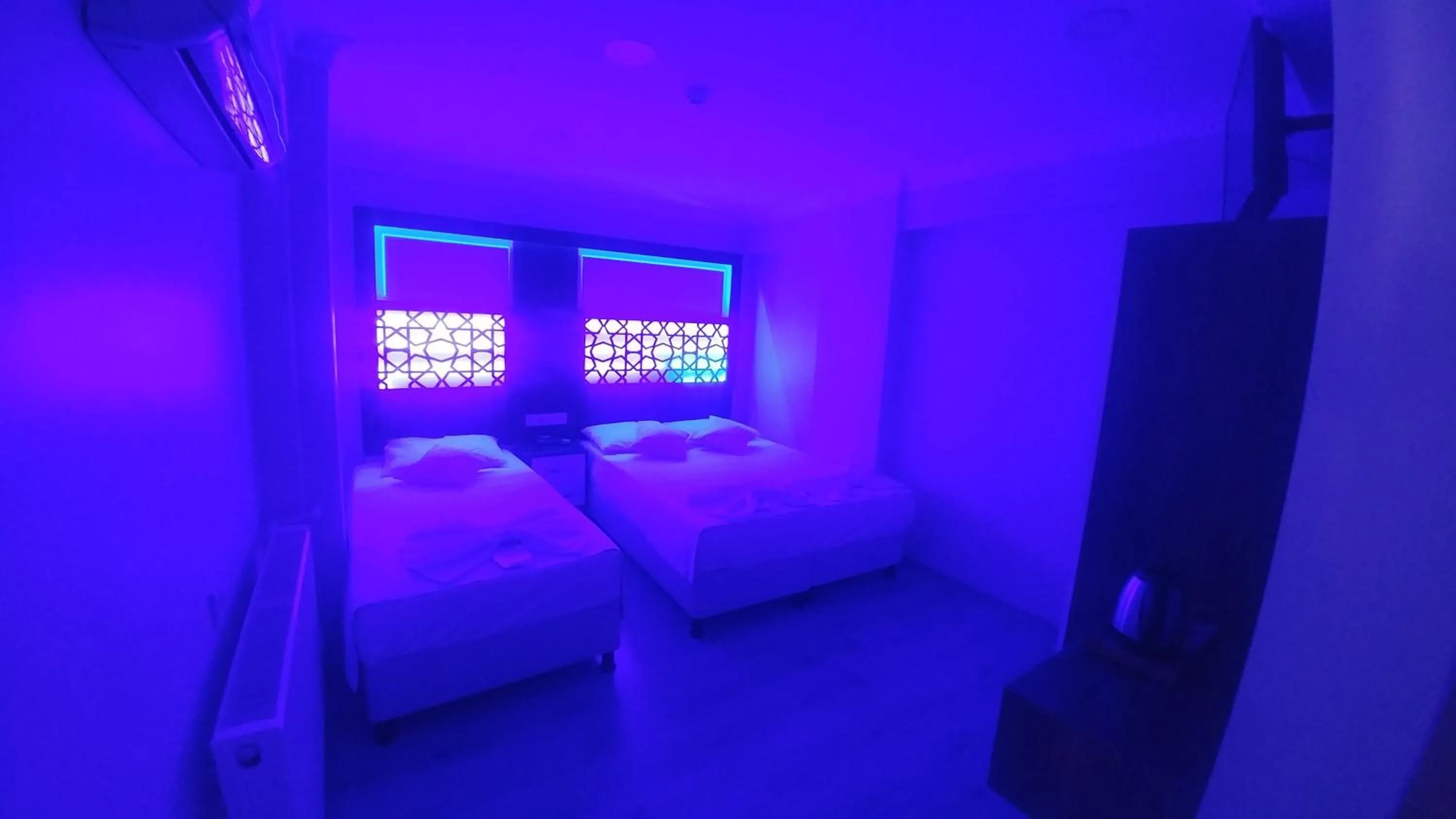 Bed in Grand Liza Hotel