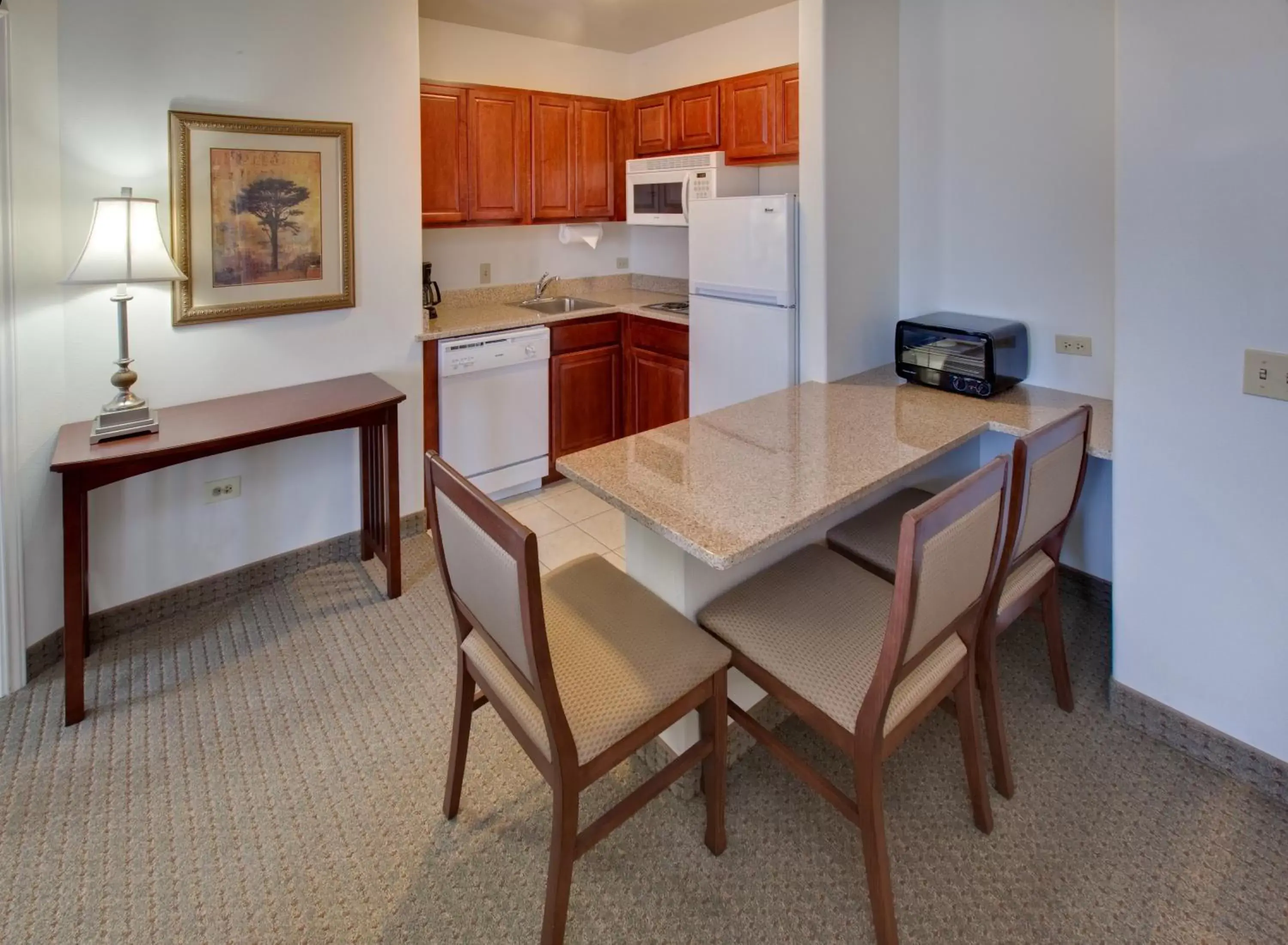 Photo of the whole room, Kitchen/Kitchenette in Staybridge Suites Rockford, an IHG Hotel