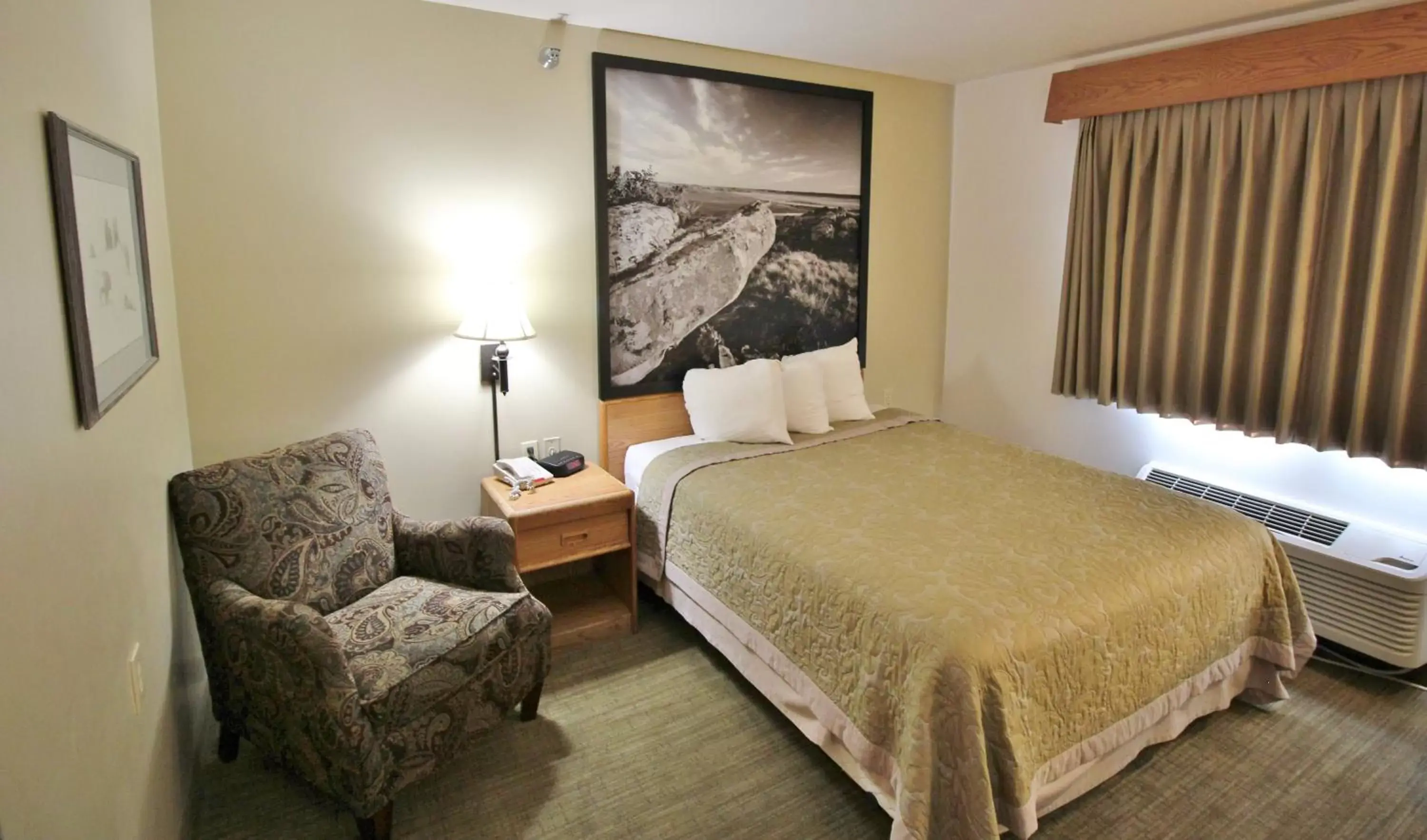 Bed in Homestead Inn and Suites