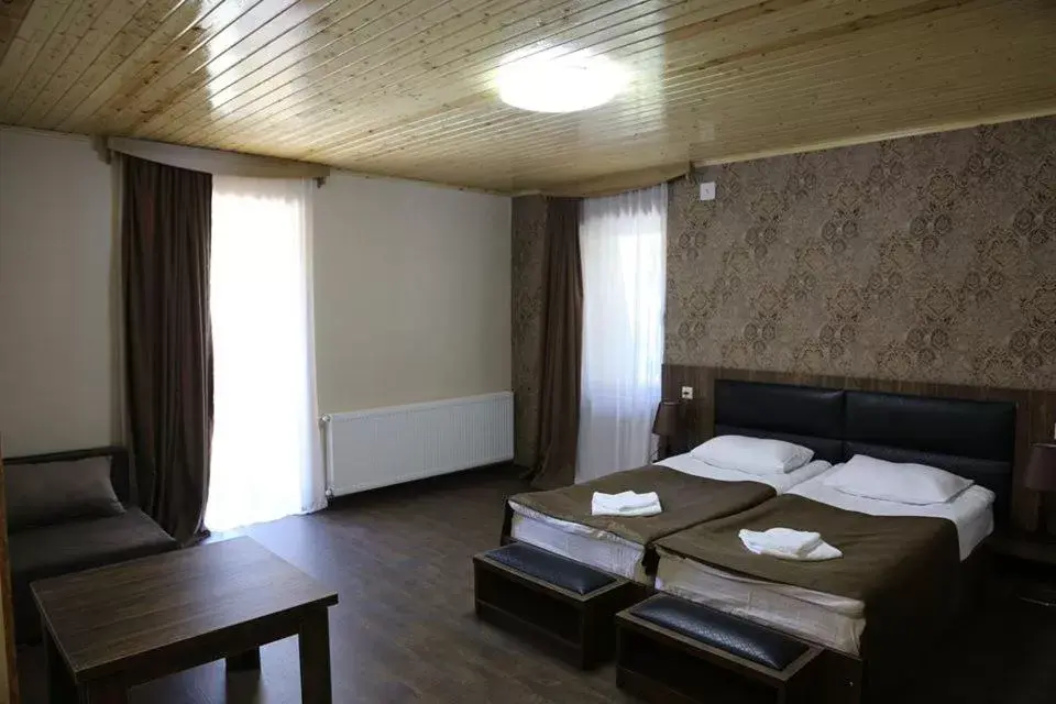 Classic Triple Room in Hotel Shgedi Mestia Classic Triple Room in Hotel Shgedi Mestia