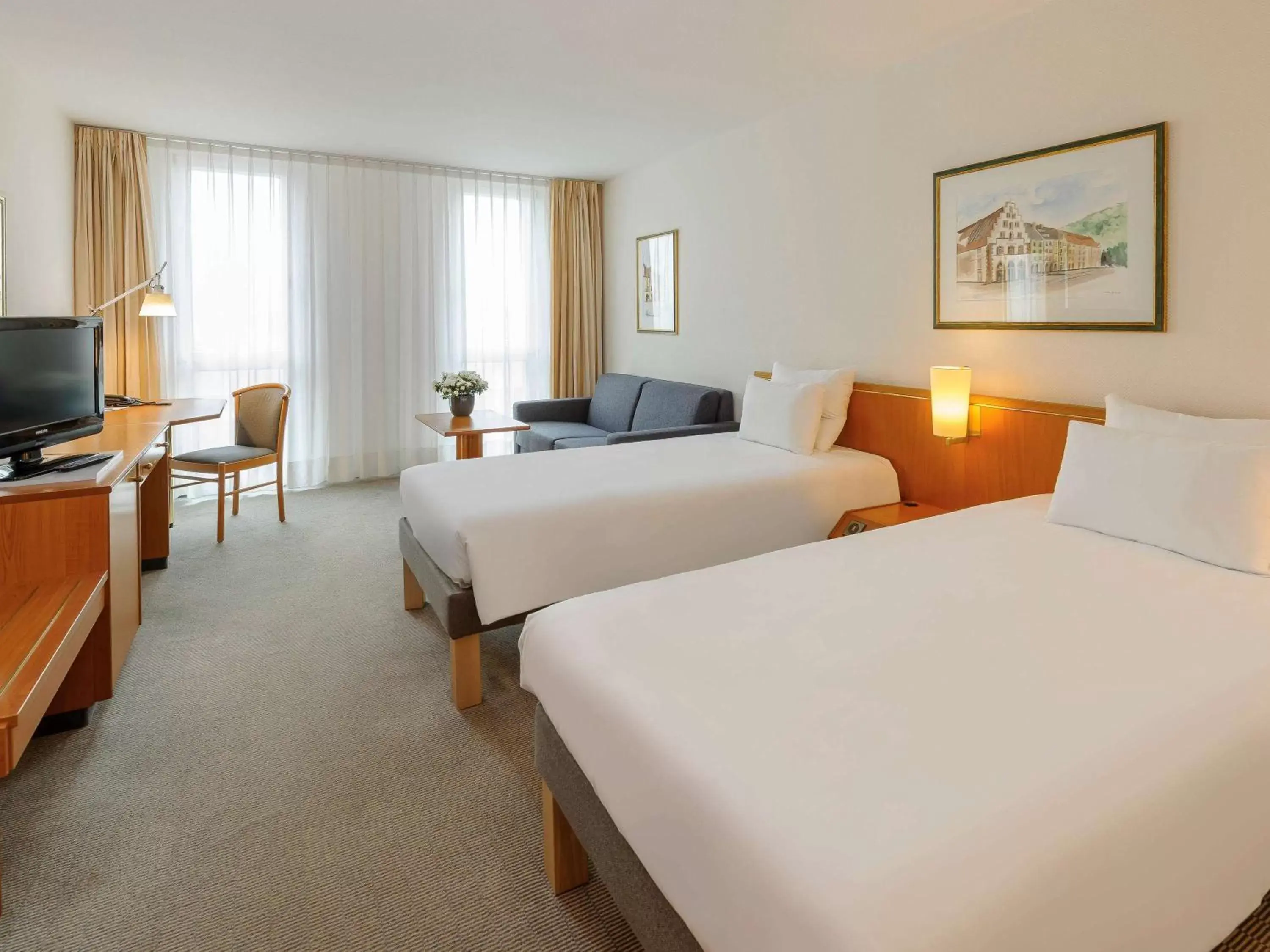 Photo of the whole room, Bed in Novotel Freiburg am Konzerthaus
