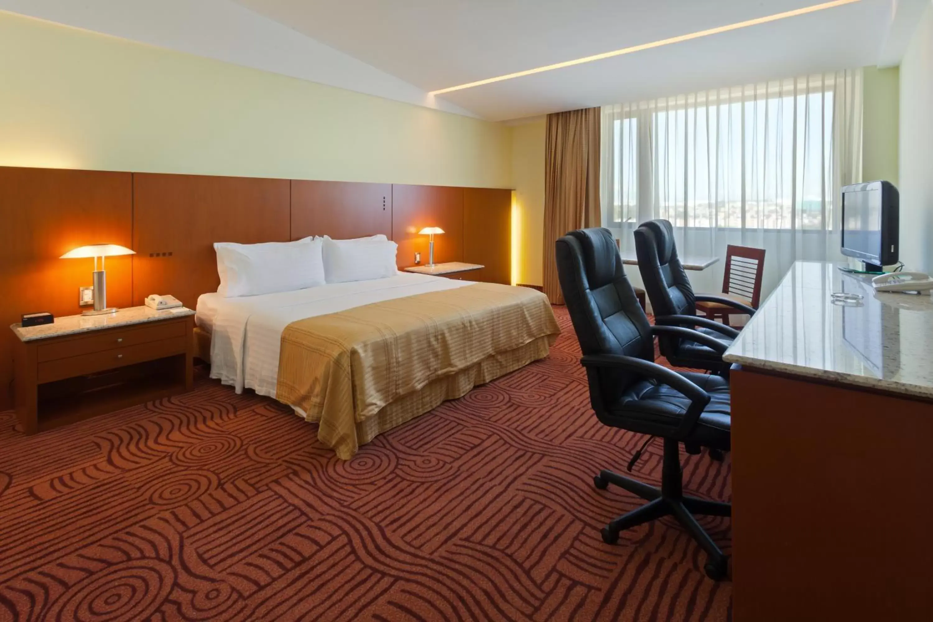 Bedroom, Bed in Holiday Inn Puebla Finsa, an IHG Hotel