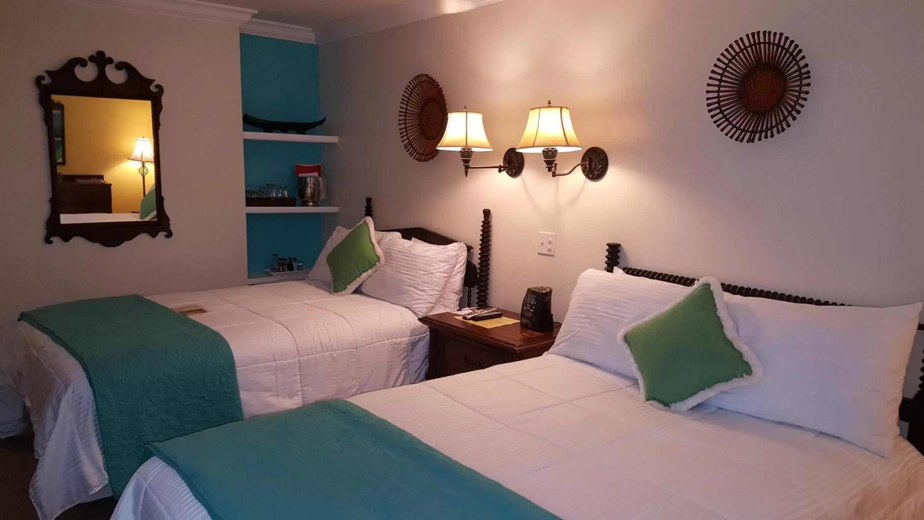 Photo of the whole room, Bed in The Caribbean Court Boutique Hotel