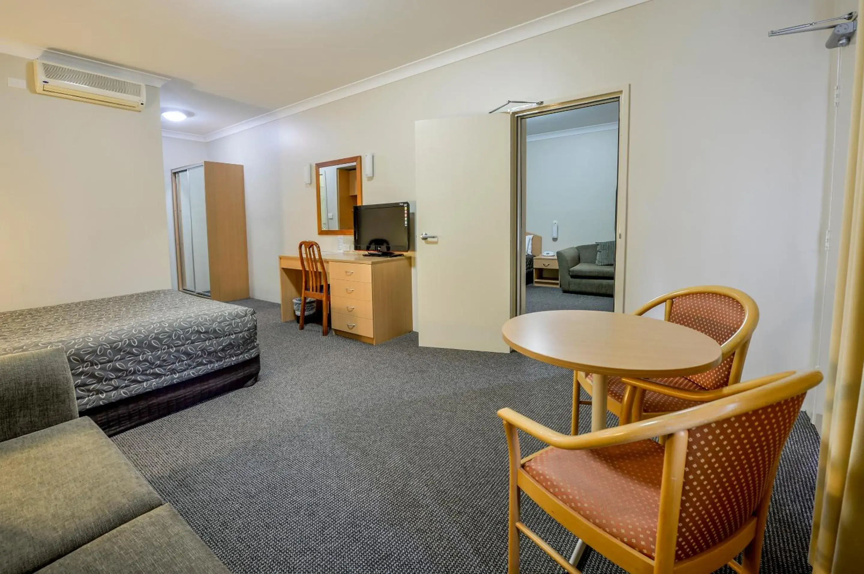 Photo of the whole room, Seating Area in Golden Guitar Motor Inn