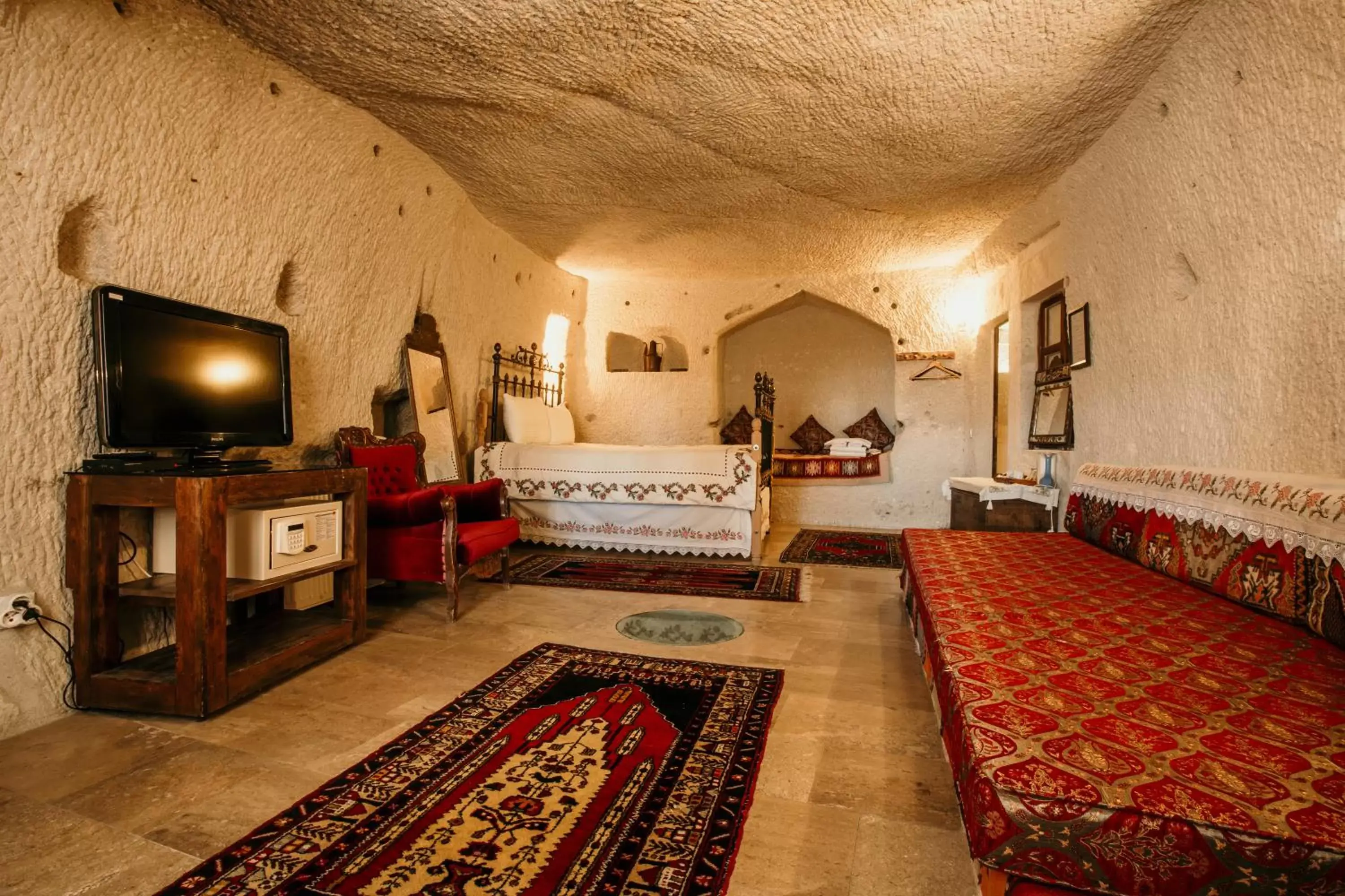 Bed, Seating Area in Village Cave House Hotel