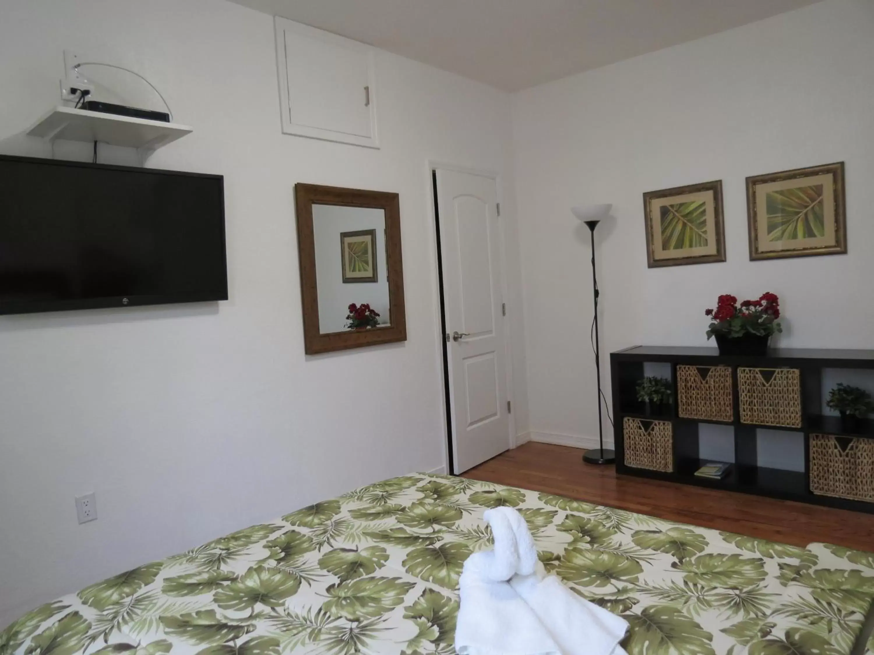 Bed, TV/Entertainment Center in Harding Boutique Apartments