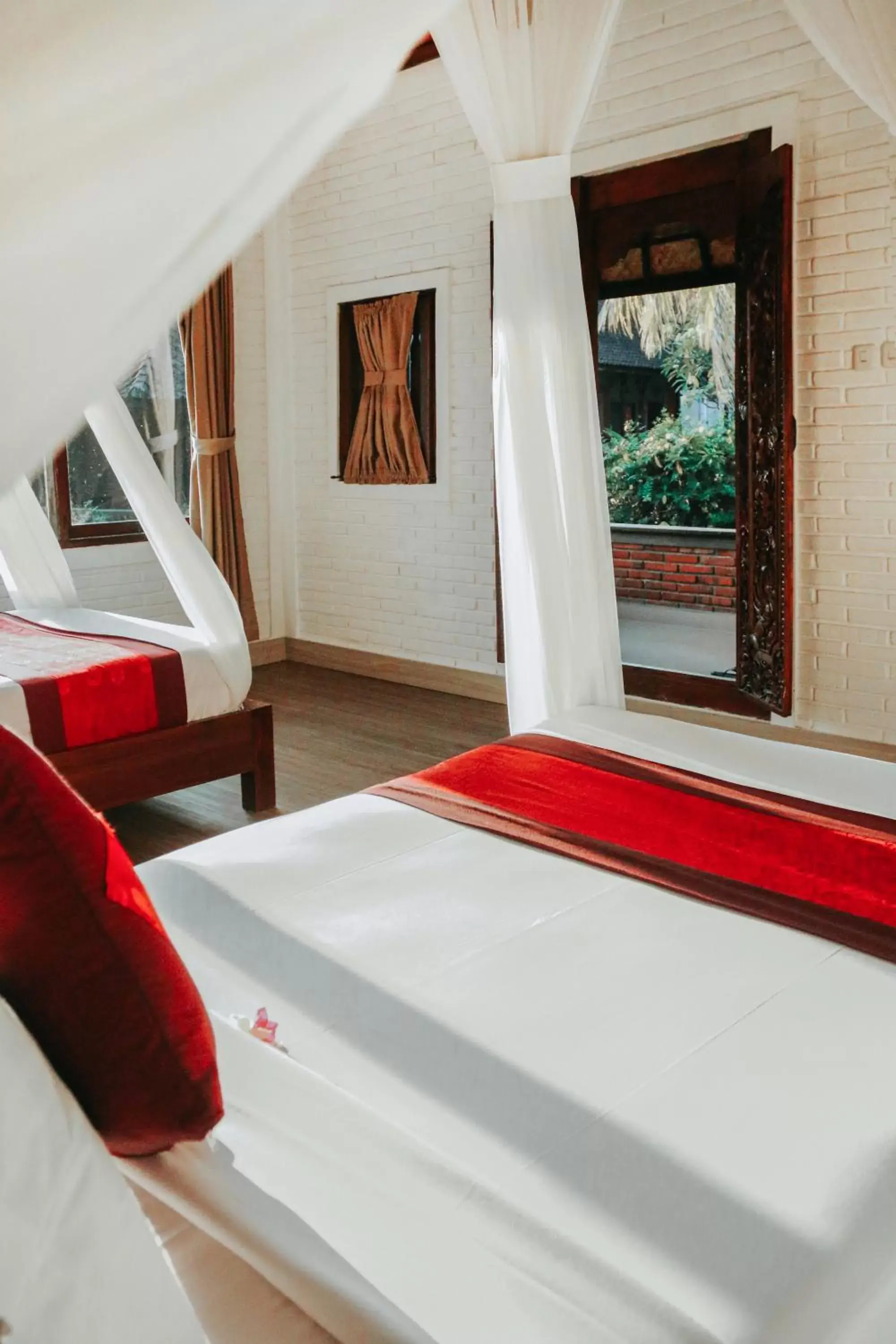 Bed in Sri Aksata Ubud Resort by Adyatma Hospitality