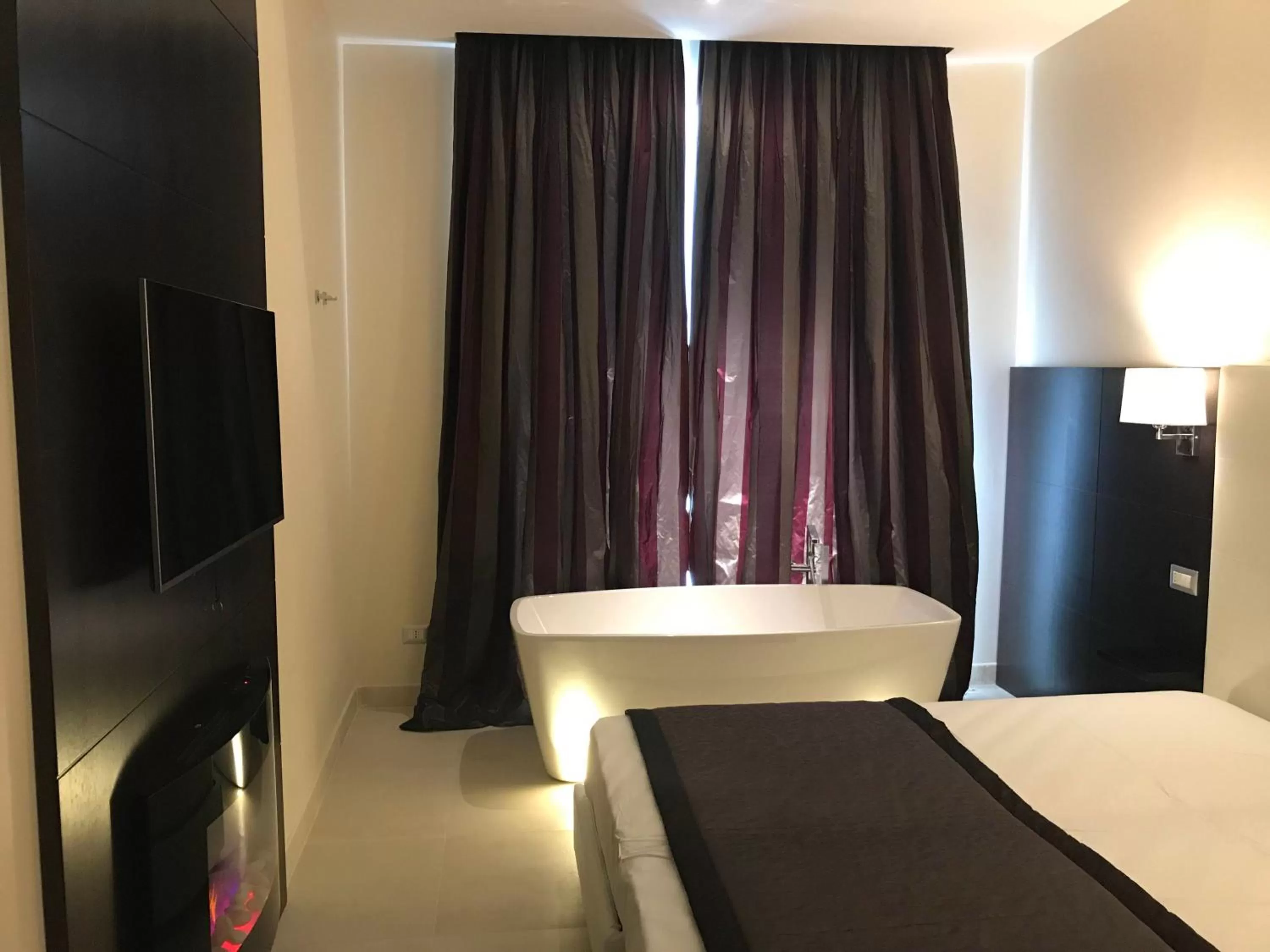 Photo of the whole room, Bed in Roman Holidays Boutique Hotel