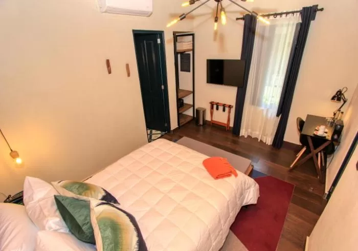 Bed in Antigua Trece Hotel Fusión