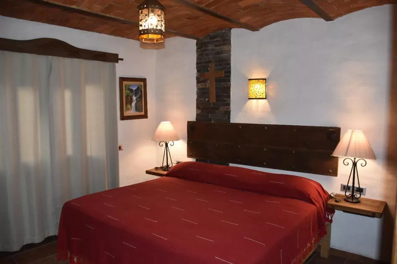 Bed in Hotel Mi Pueblito by Rotamundos