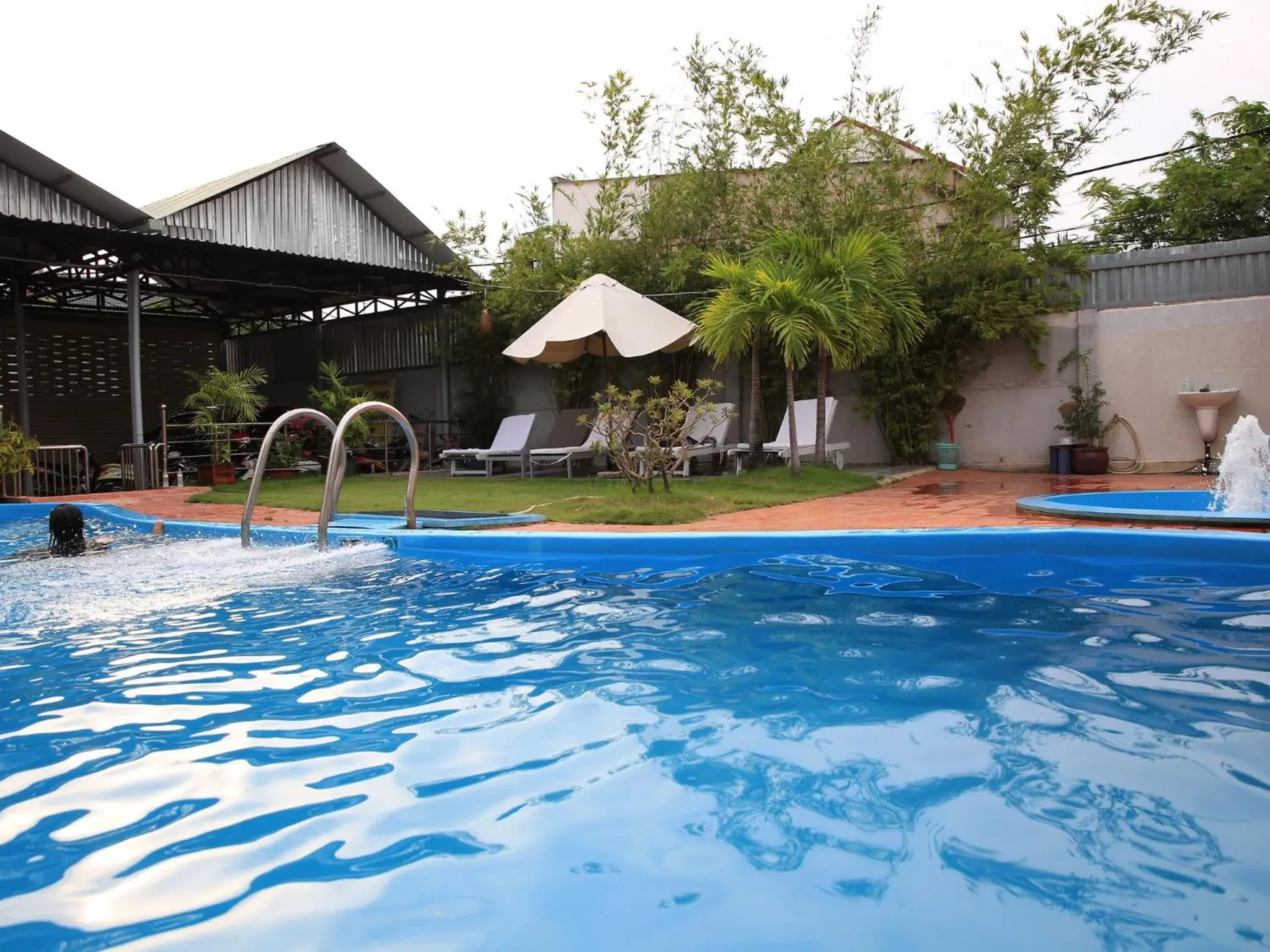 Swimming pool, Property Building in Hoa Phat Hotel & Apartment