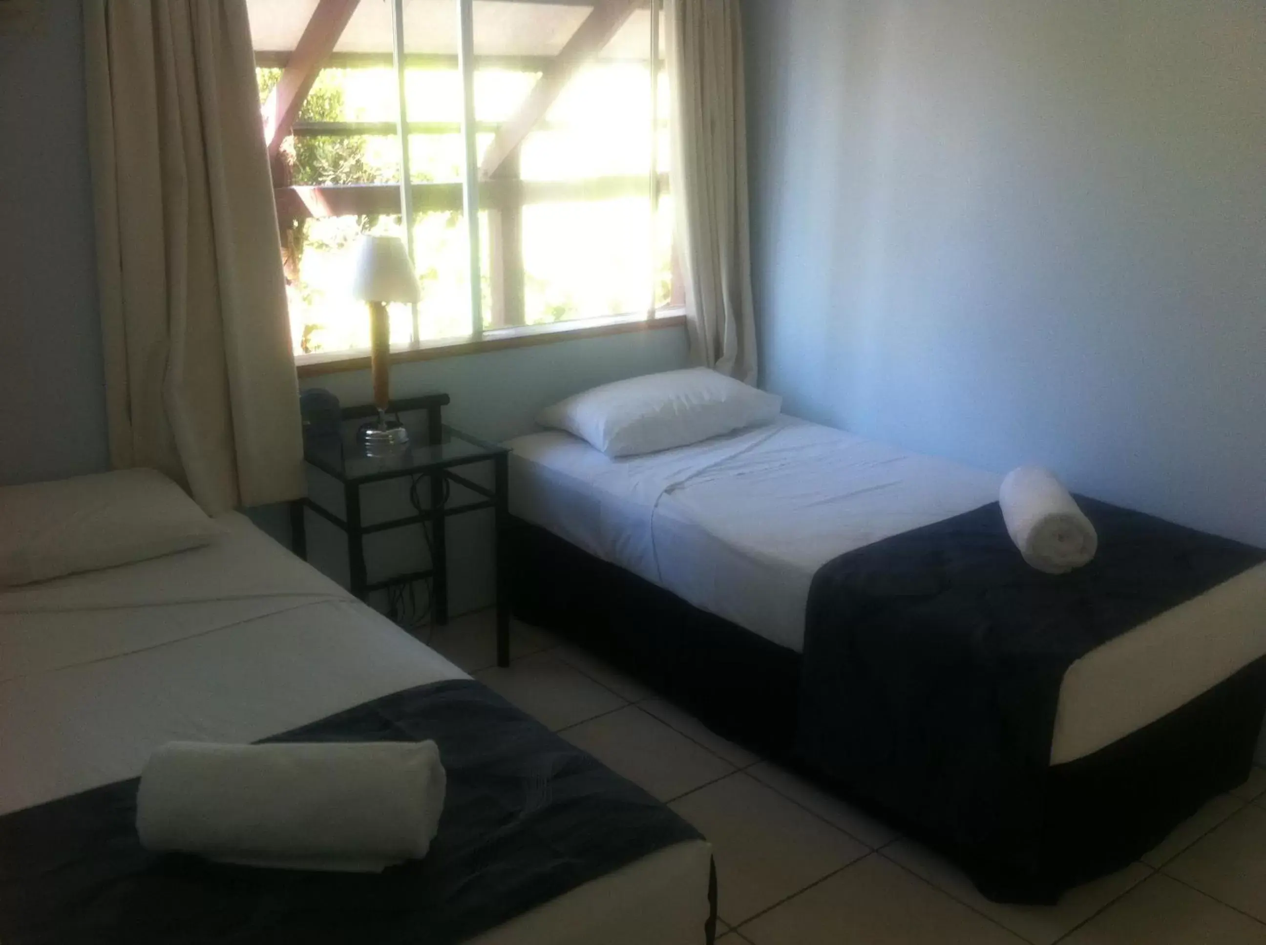 Bed in Reef Gateway Apartments