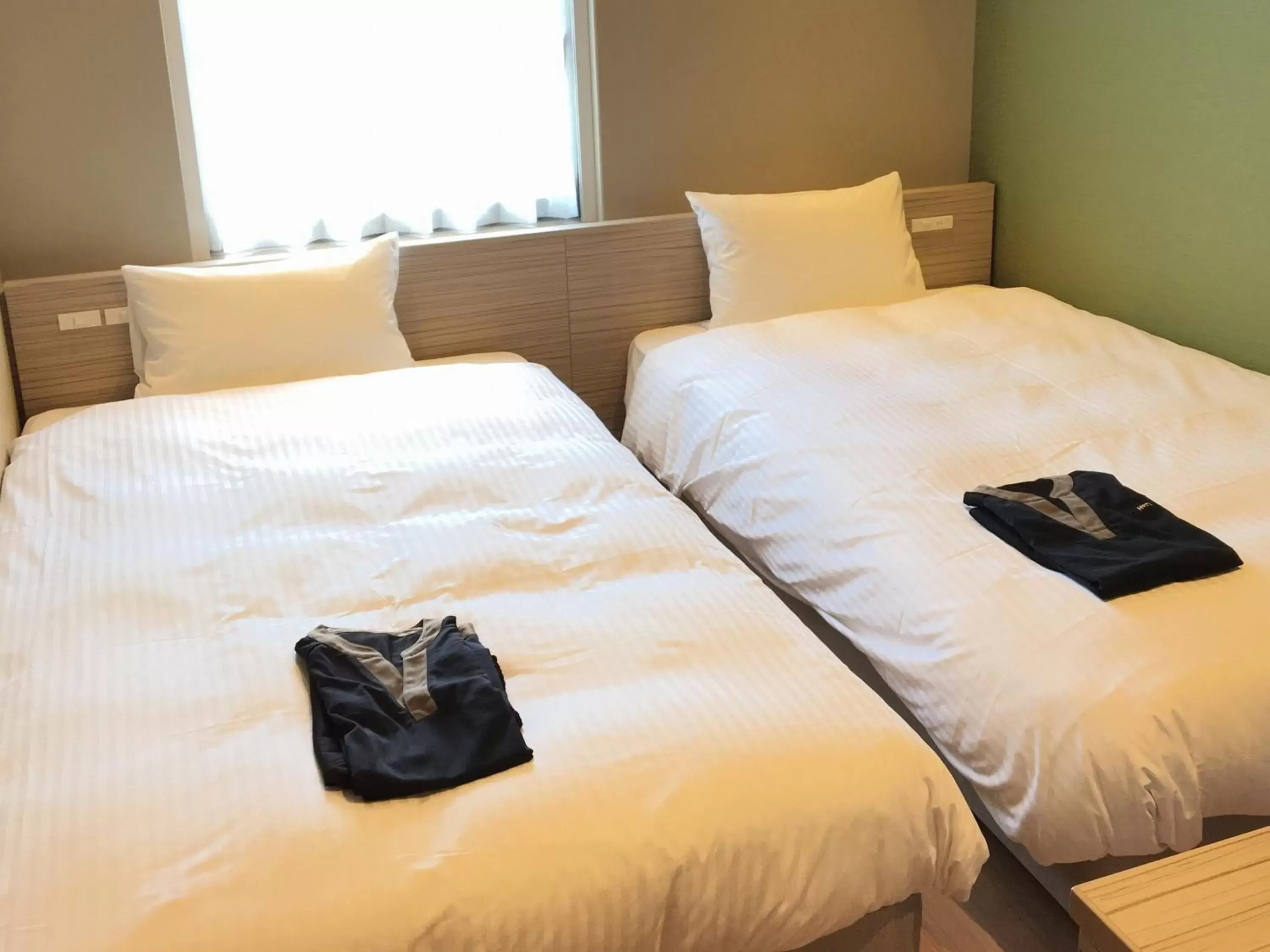 Bed in Hotel WBF Grande Hakata