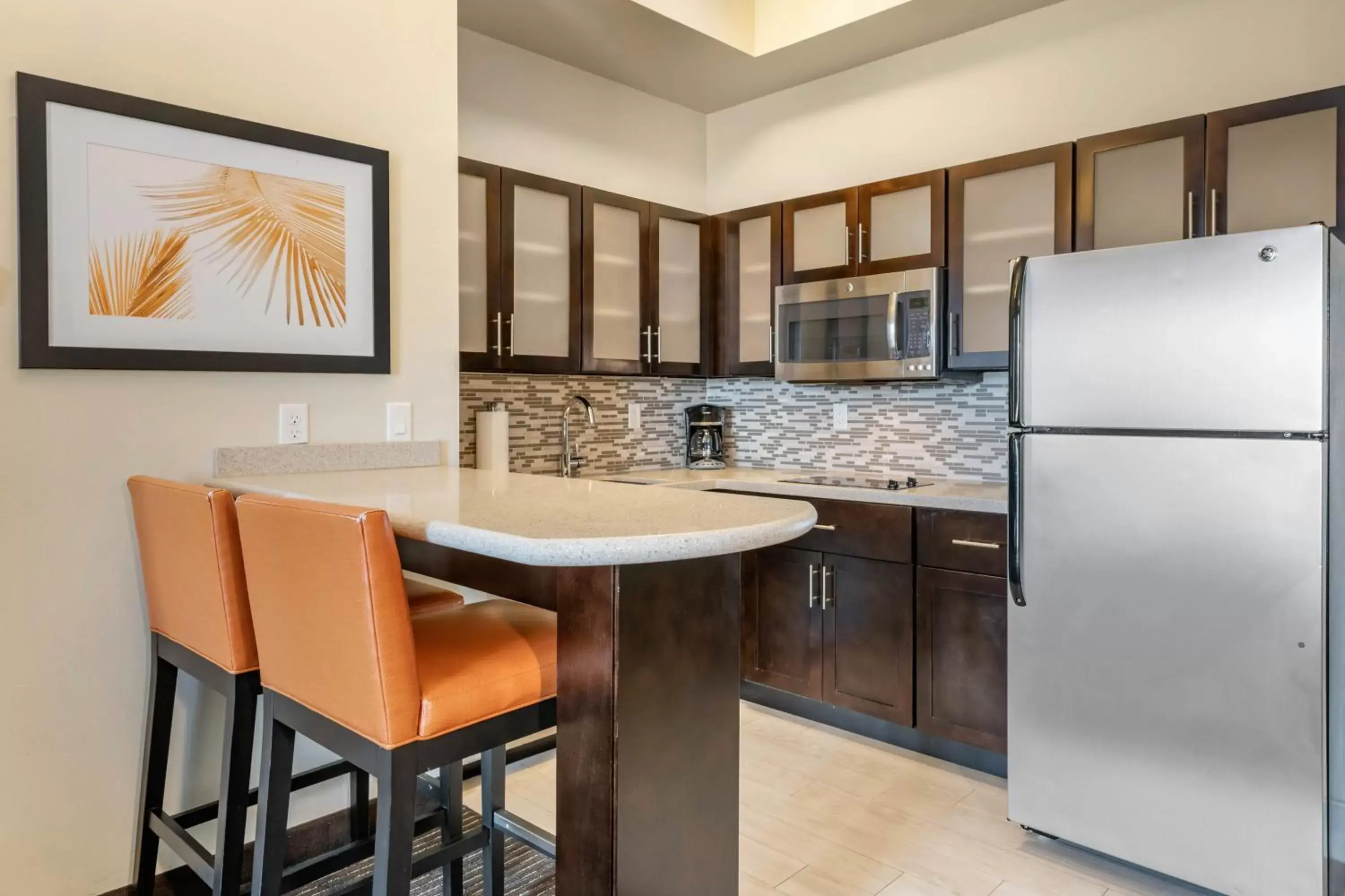 Photo of the whole room, Kitchen/Kitchenette in Staybridge Suites St. Petersburg FL, an IHG Hotel