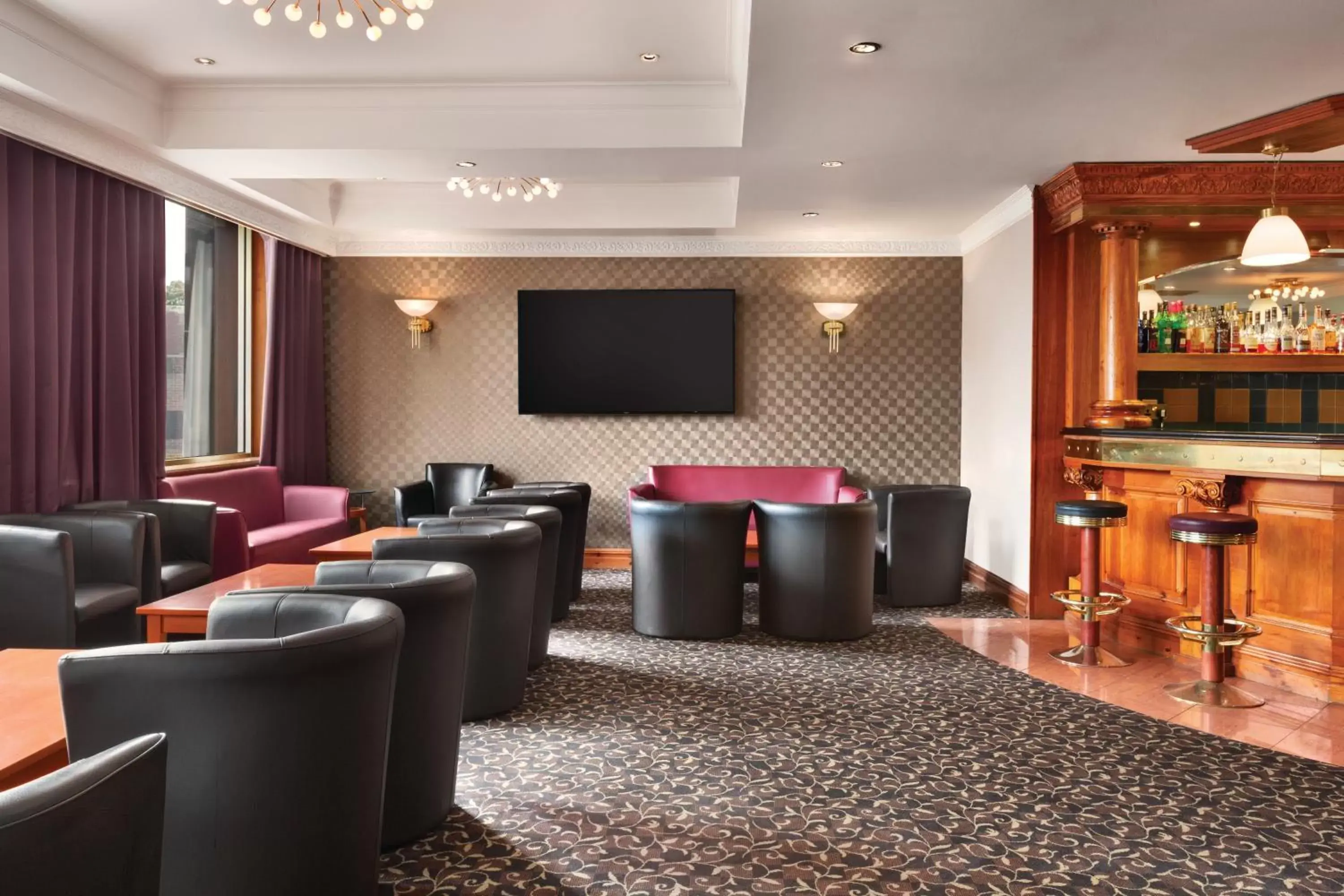 Communal lounge/ TV room in Savera Hotel South Ruislip