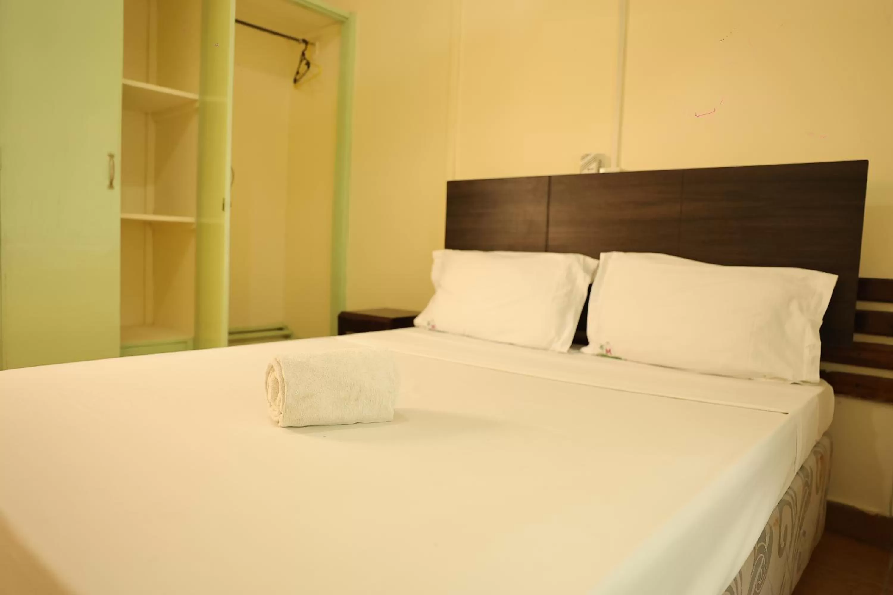 Bed in Merry Villa Hotel & Apartments
