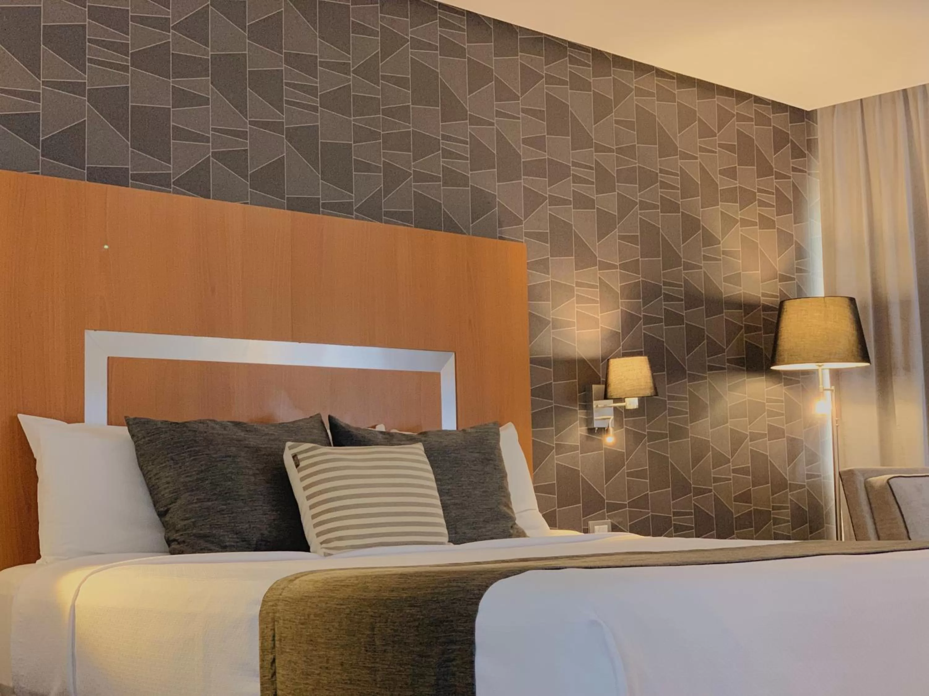 Bed in Hotel Mercury Inn