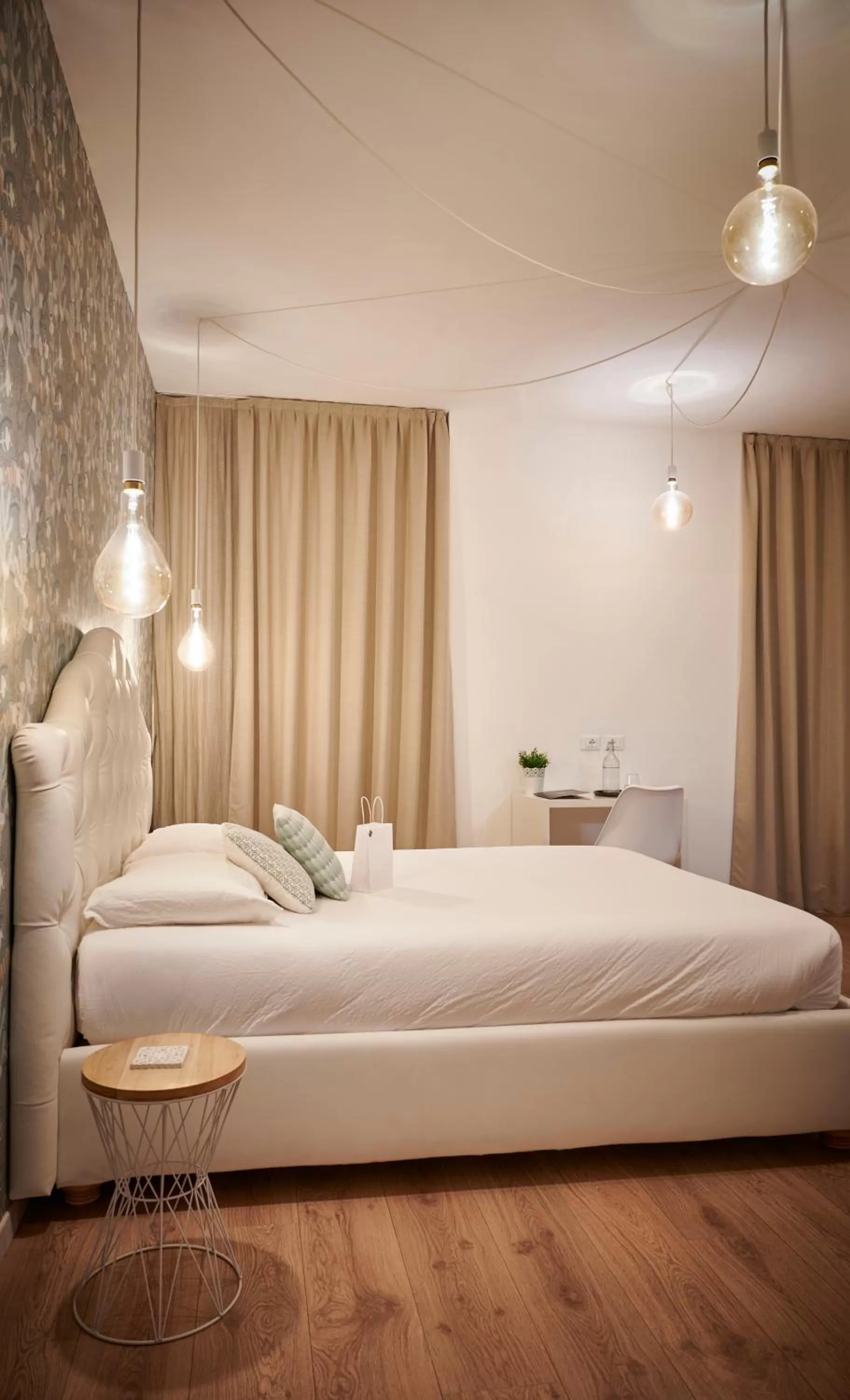 Bed in Lainez Rooms & Suites