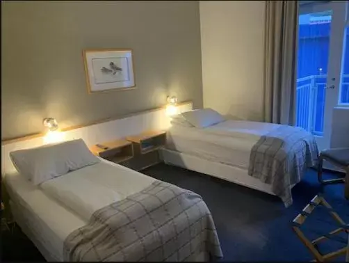 Photo of the whole room, Bed in Hotel Norðurland