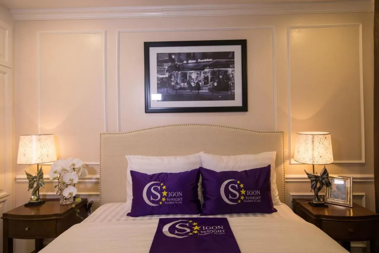 Bed in Saigon By Night Luxury Hotel