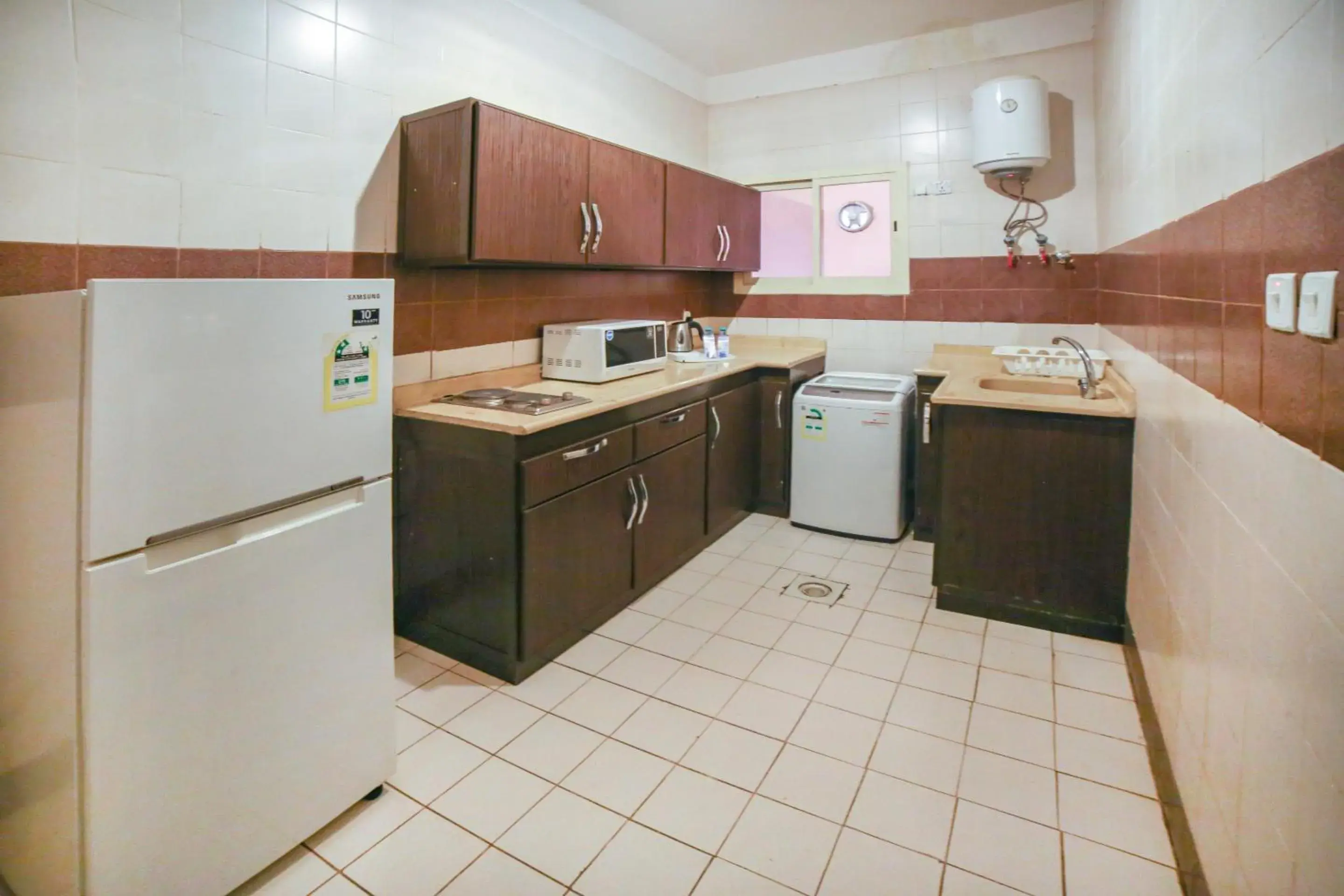 Kitchen or kitchenette, Kitchen/Kitchenette in OYO 401 Al Zaidan For Furnished Units