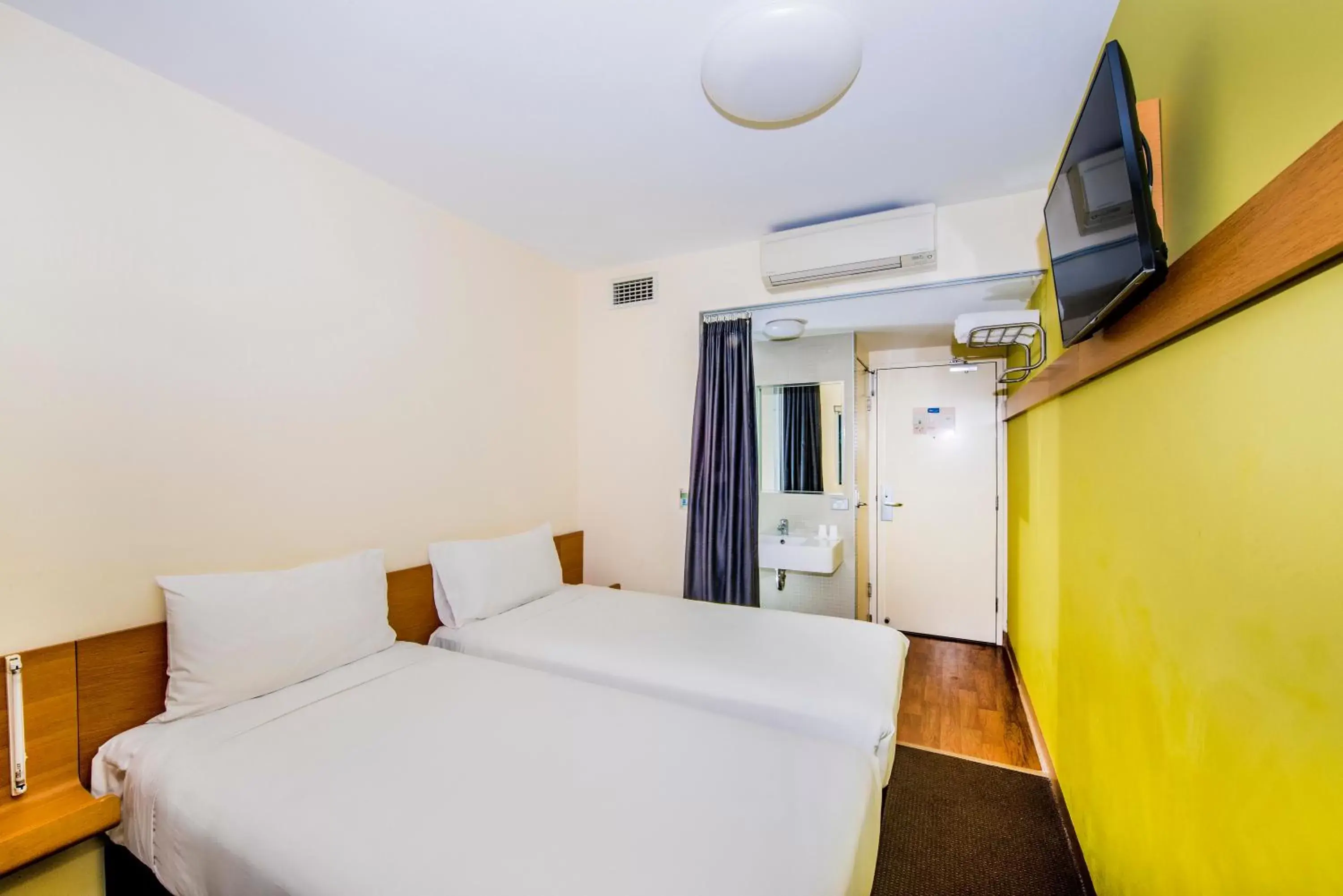 Photo of the whole room, Bed in ibis Budget Sydney Olympic Park