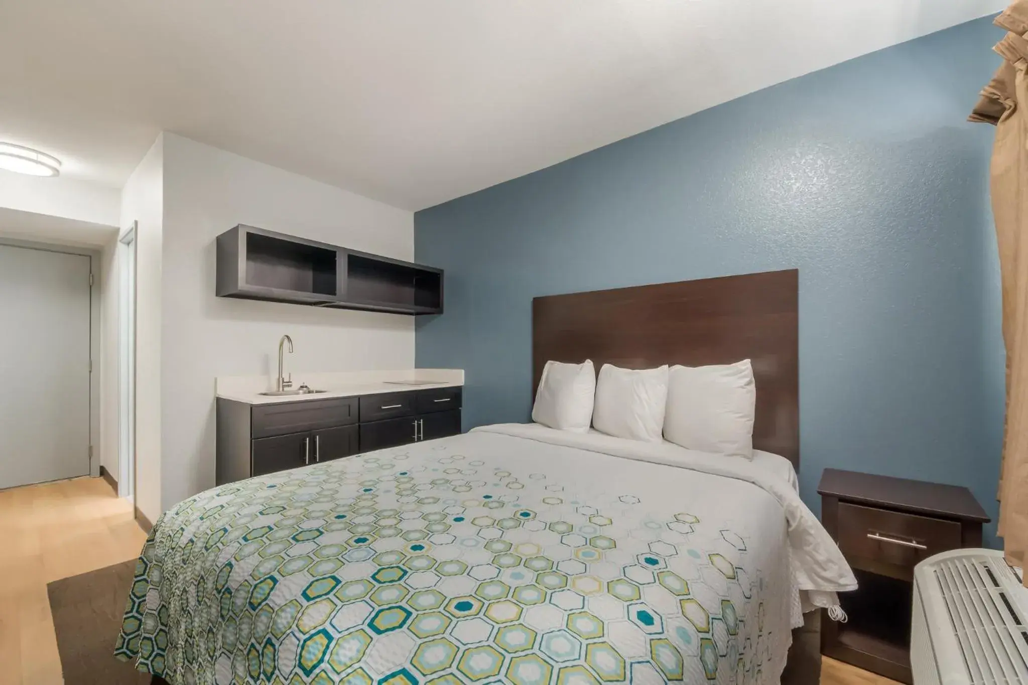 Bedroom, Bed in HomeTowne Studios by Red Roof San Antonio - SeaWorld Northwest