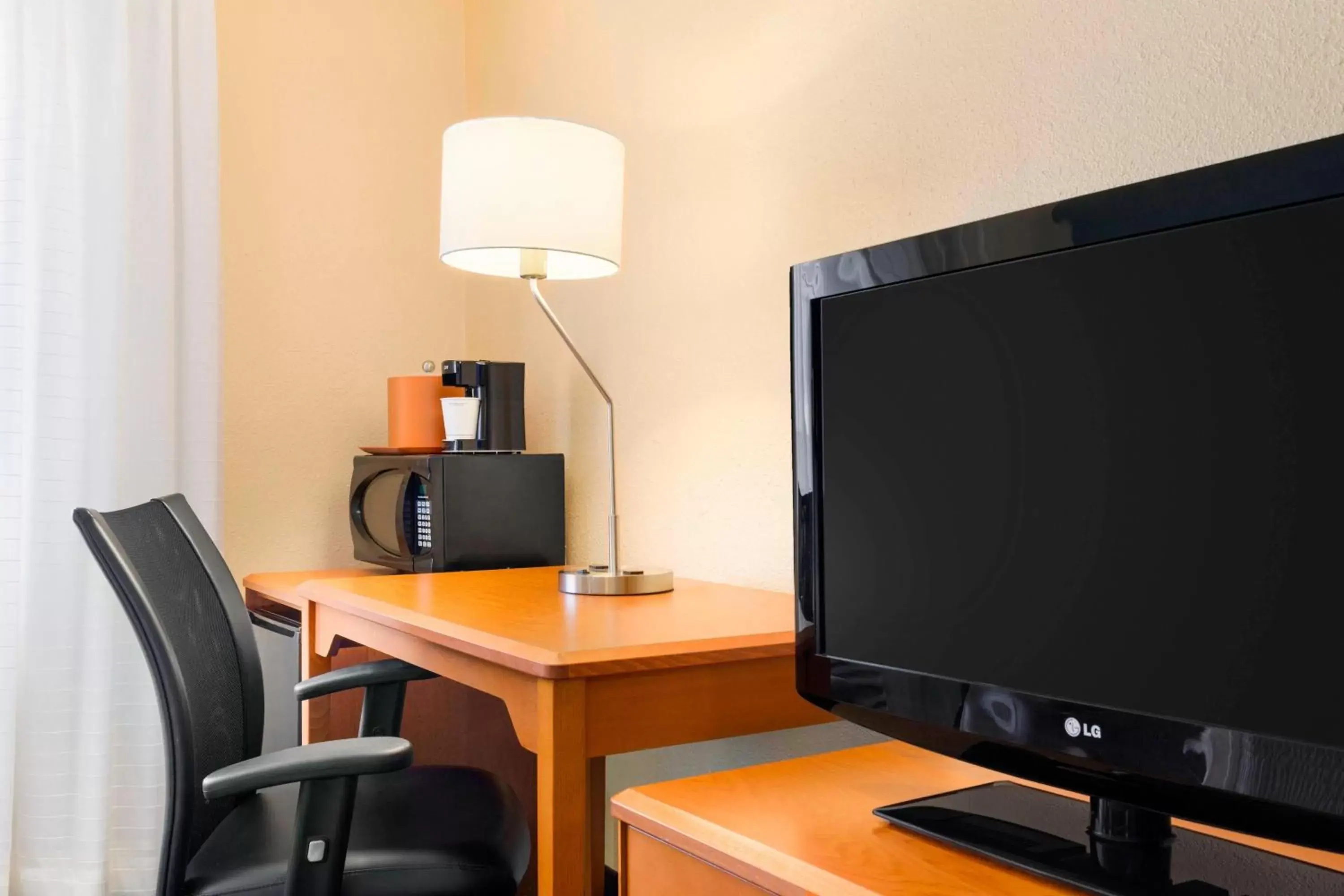 Photo of the whole room, TV/Entertainment Center in Fairfield Inn & Suites Saginaw