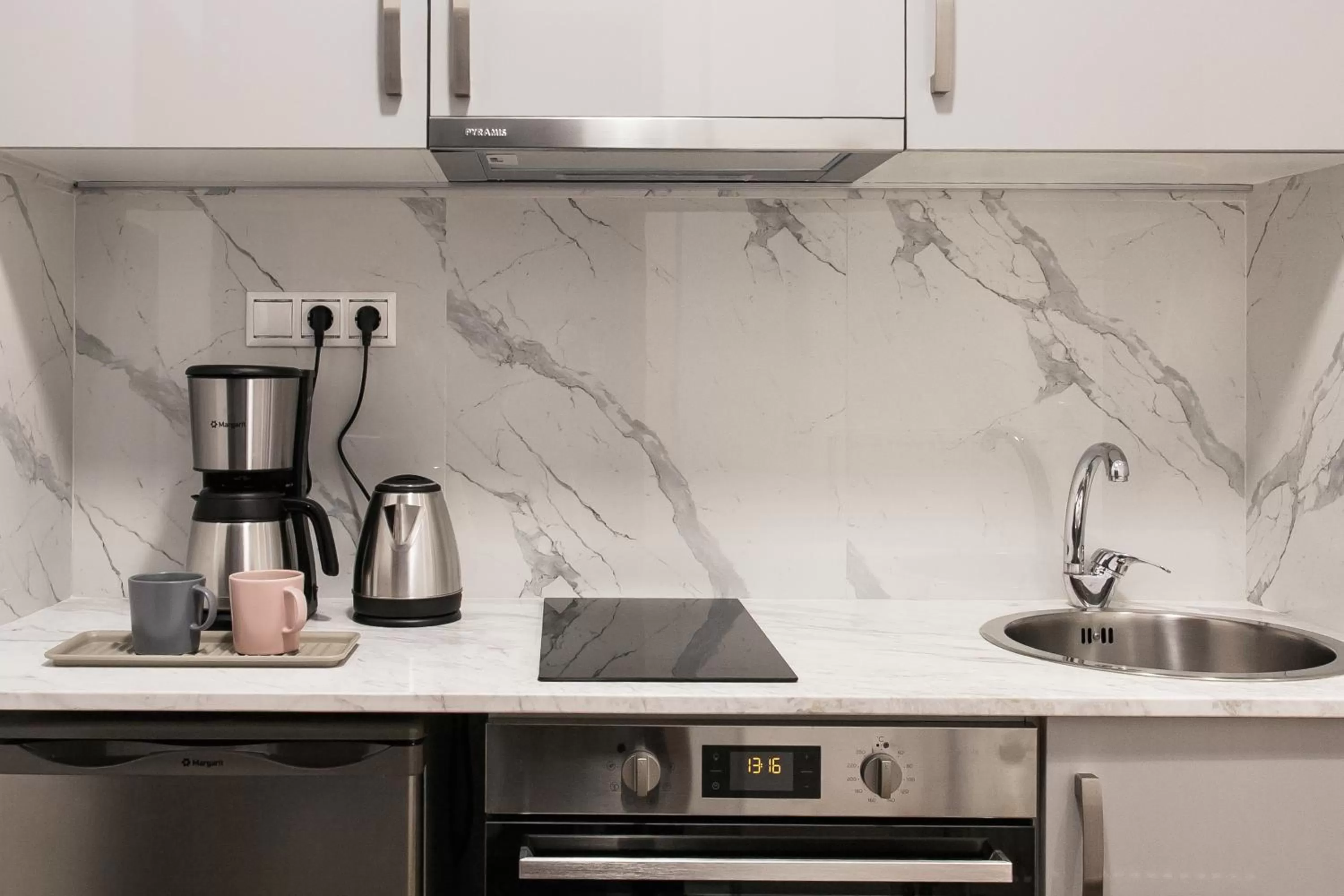 stove in Nicholas Point Apartments and Rooms