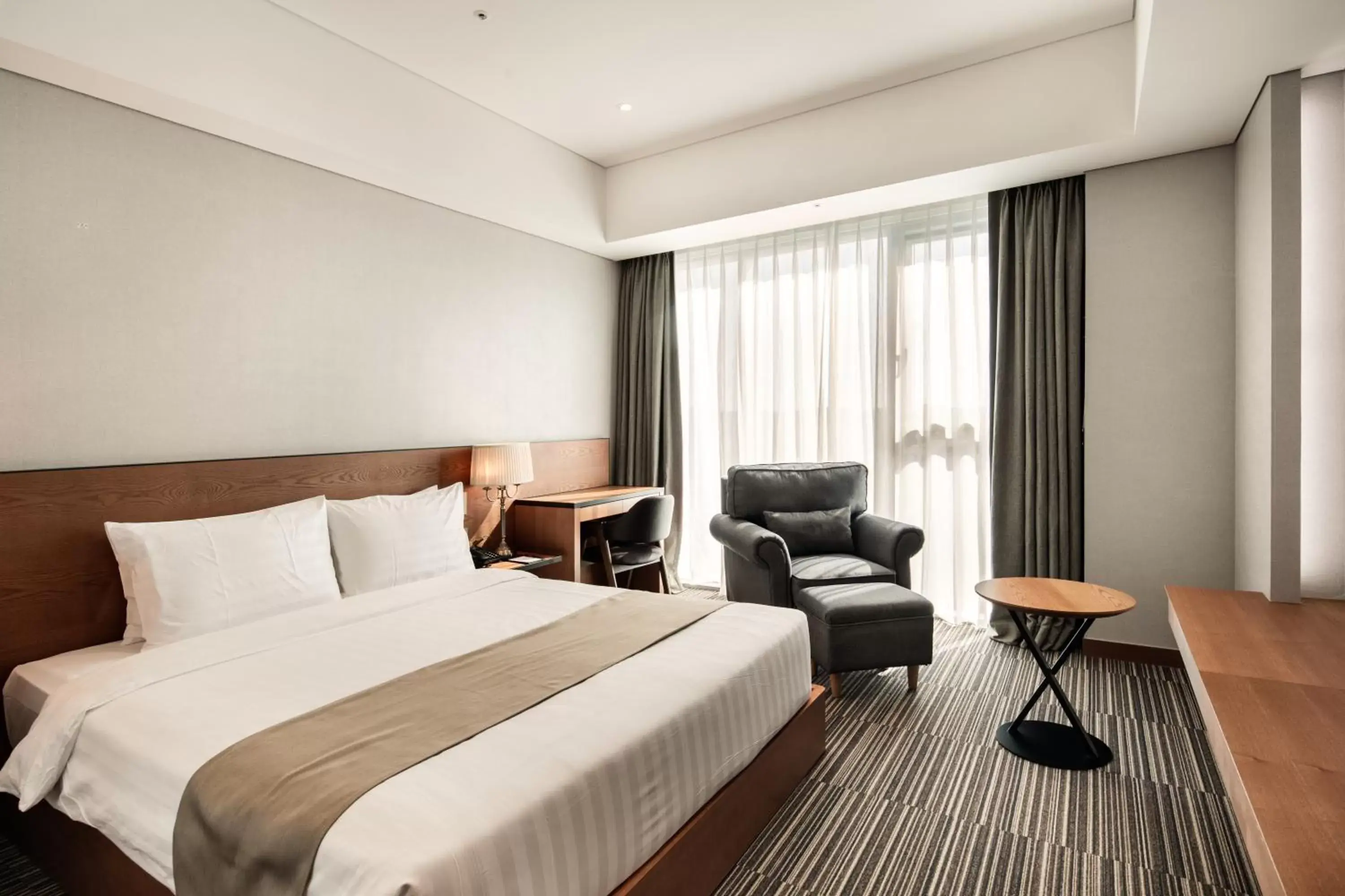 Bed in Golden Tulip Incheon Airport Hotel