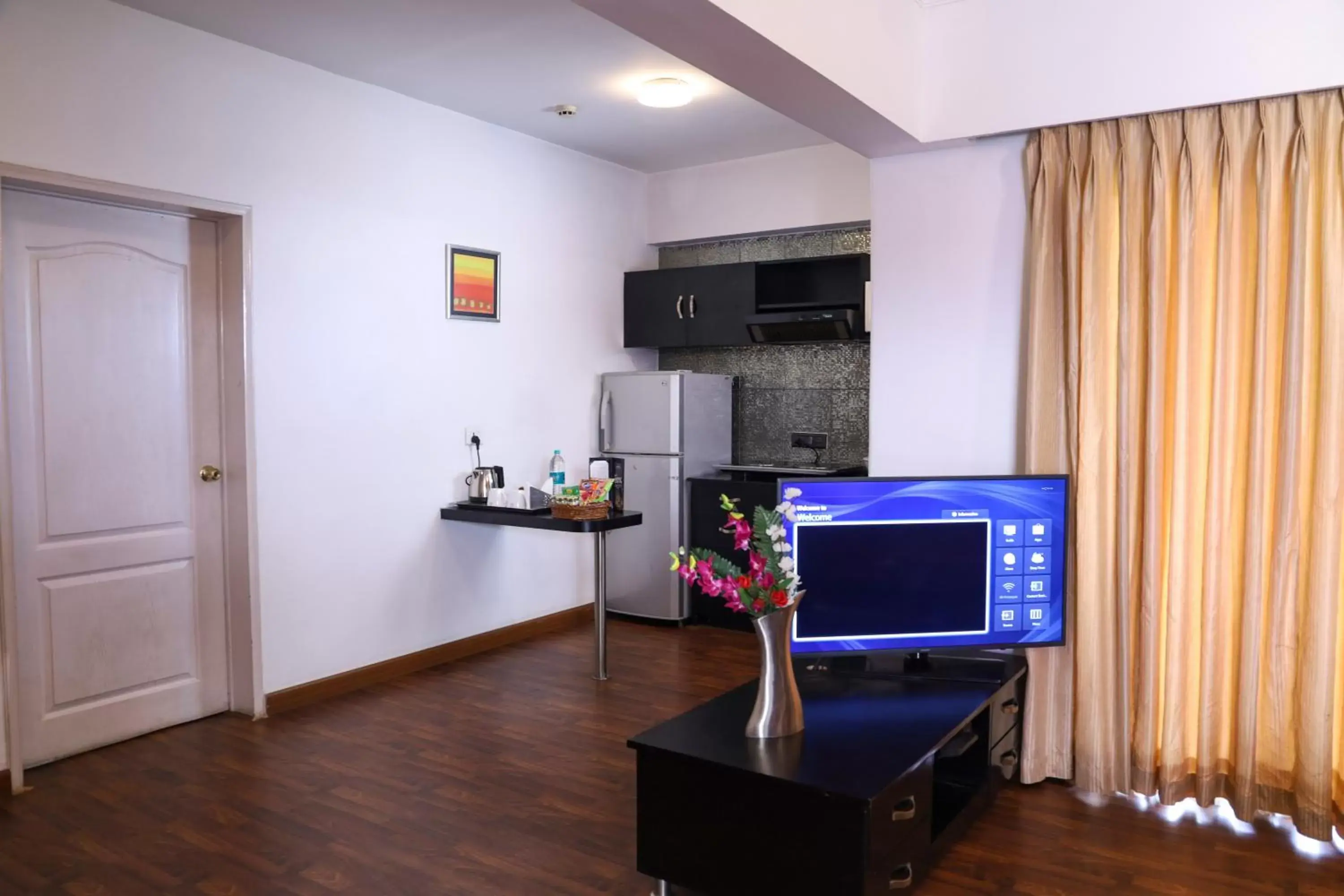 Communal lounge/ TV room, TV/Entertainment Center in Royal Orchid Golden Suites Pune