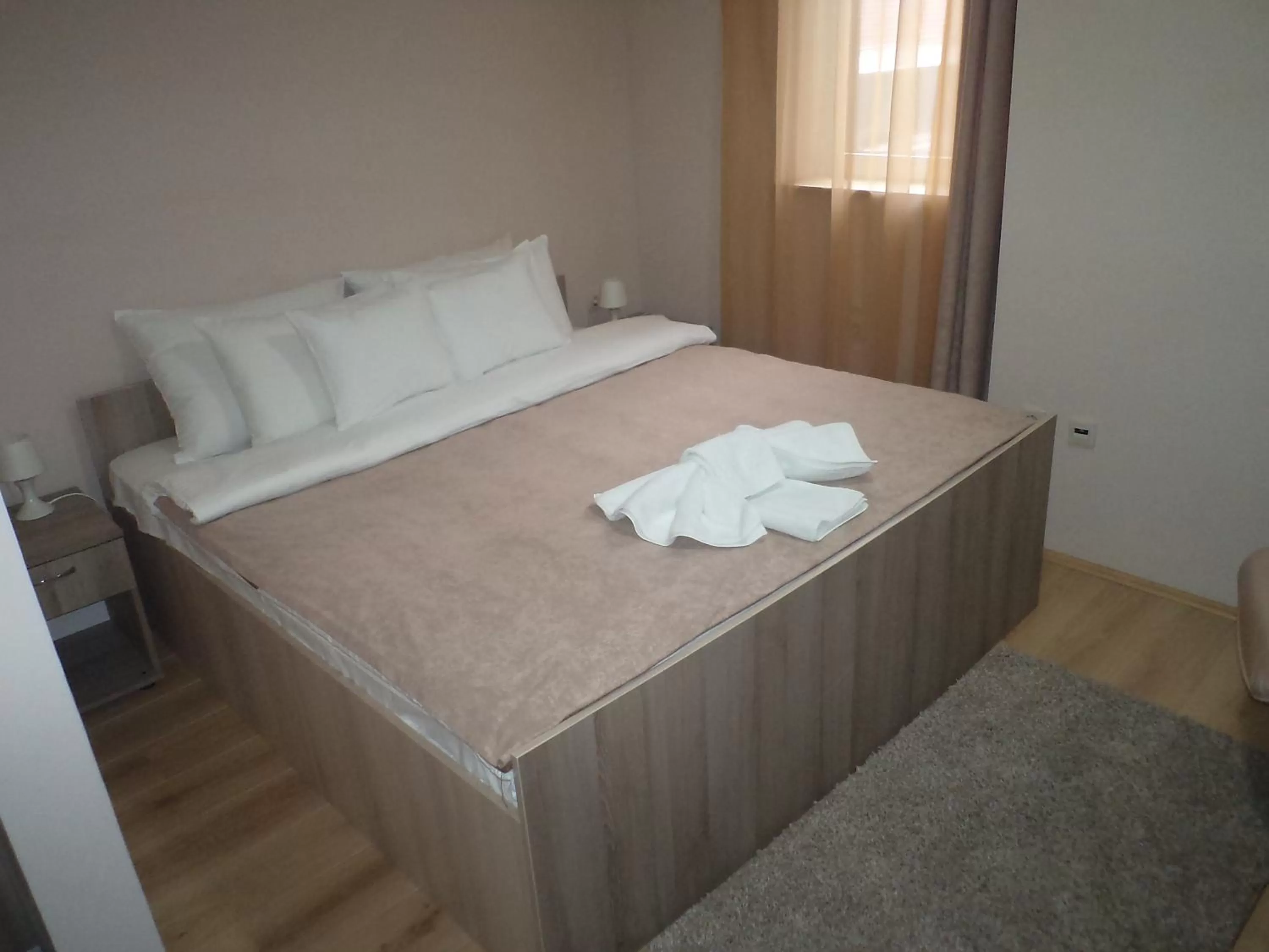 Bed in Garni Hotel Tri O