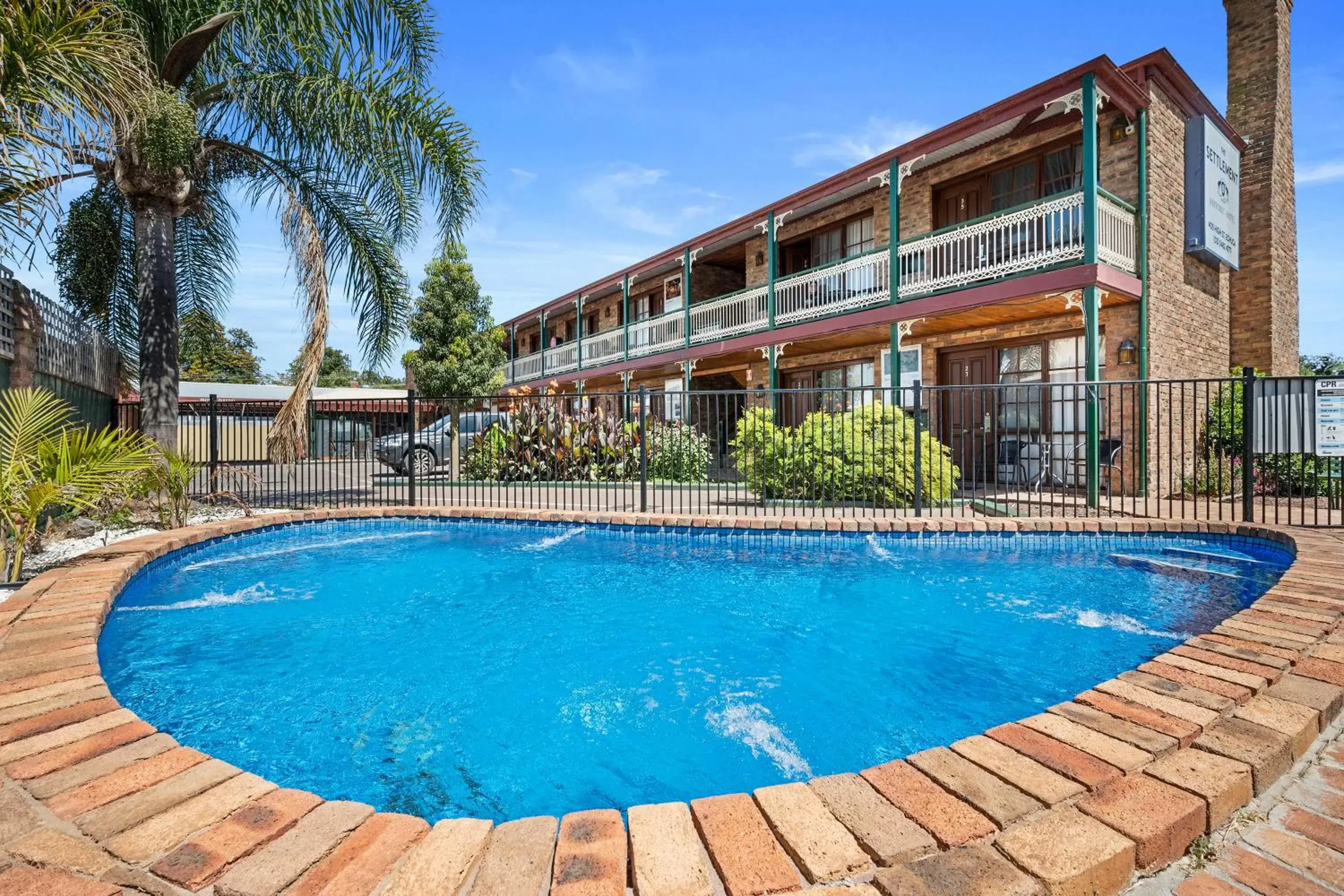 Swimming pool, Property Building in The Settlement Historic Hotel