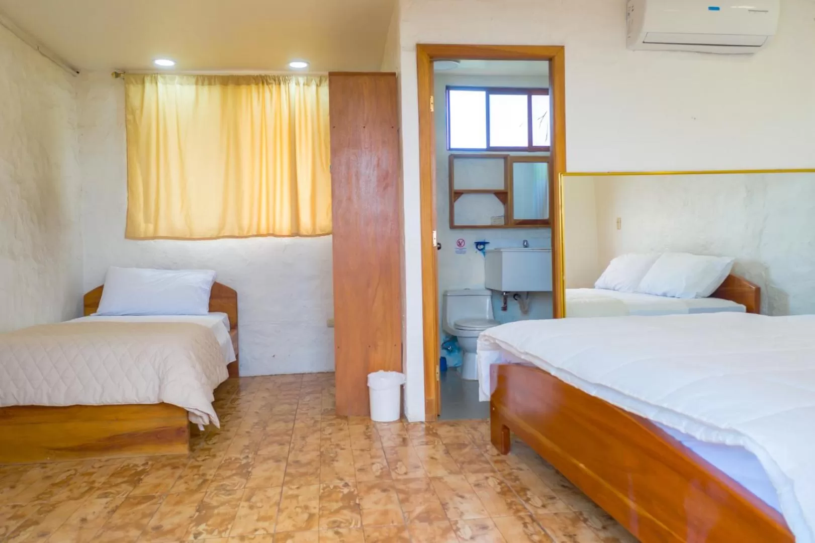 Bed in Royal Galápagos Inn