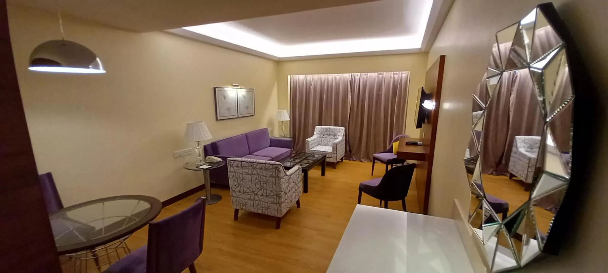 Communal lounge/ TV room, Bed in Manjeera Premiere