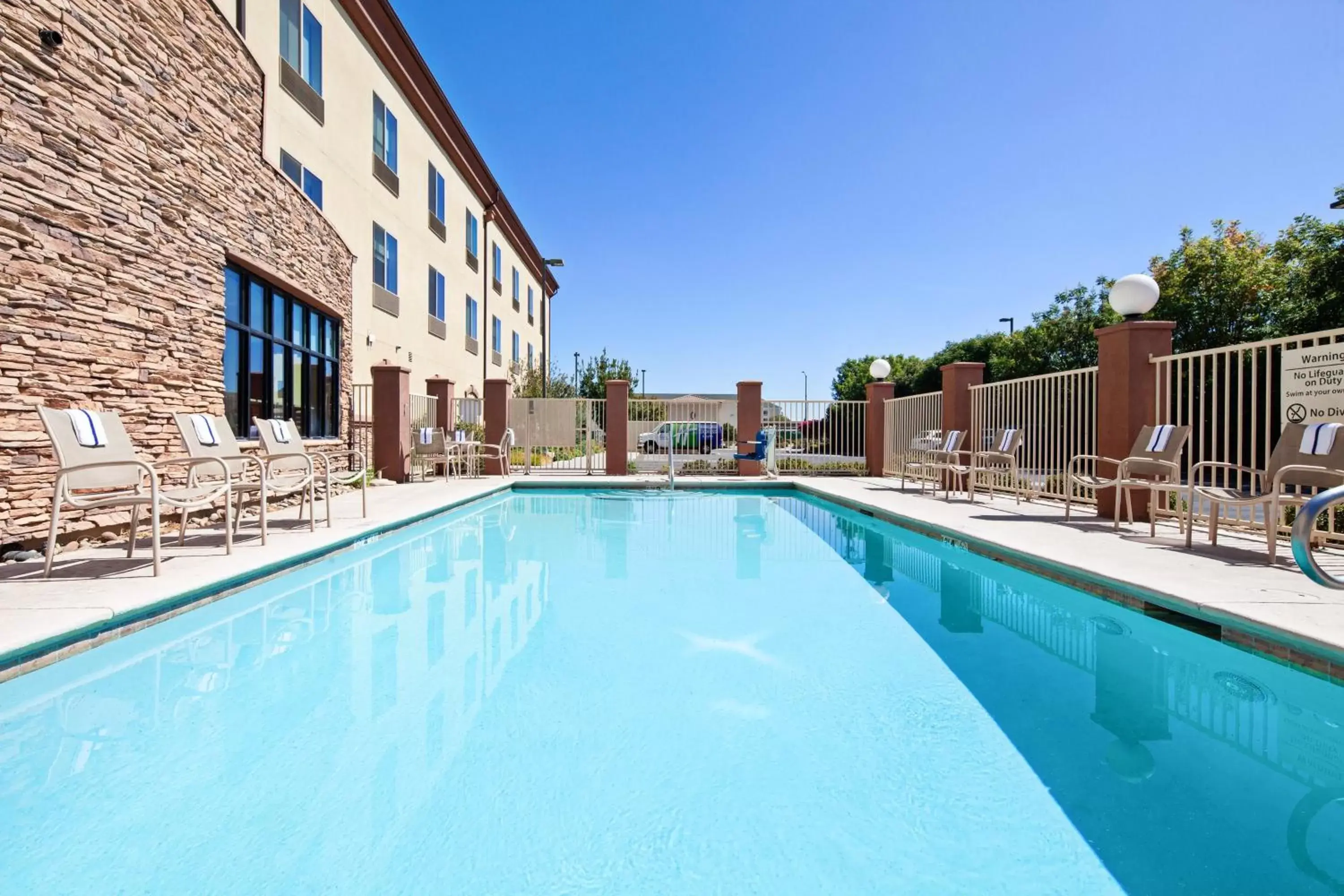 Swimming pool in Holiday Inn Express & Suites Clovis Fresno Area by IHG Swimming pool in Holiday Inn Express & Suites Clovis Fresno Area by IHG