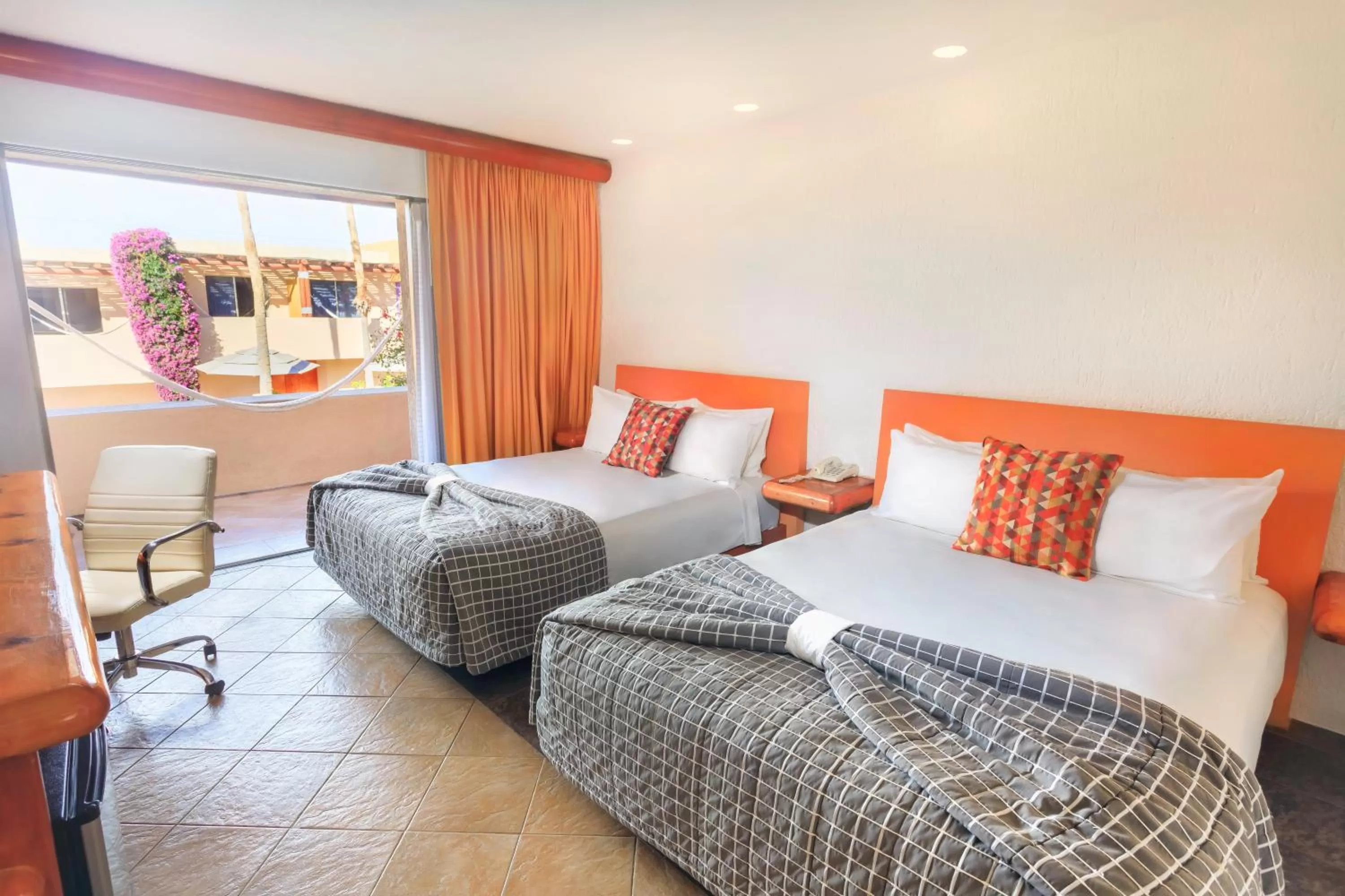 Standard Room with 2 queen size beds and patio in Hotel Los Patios