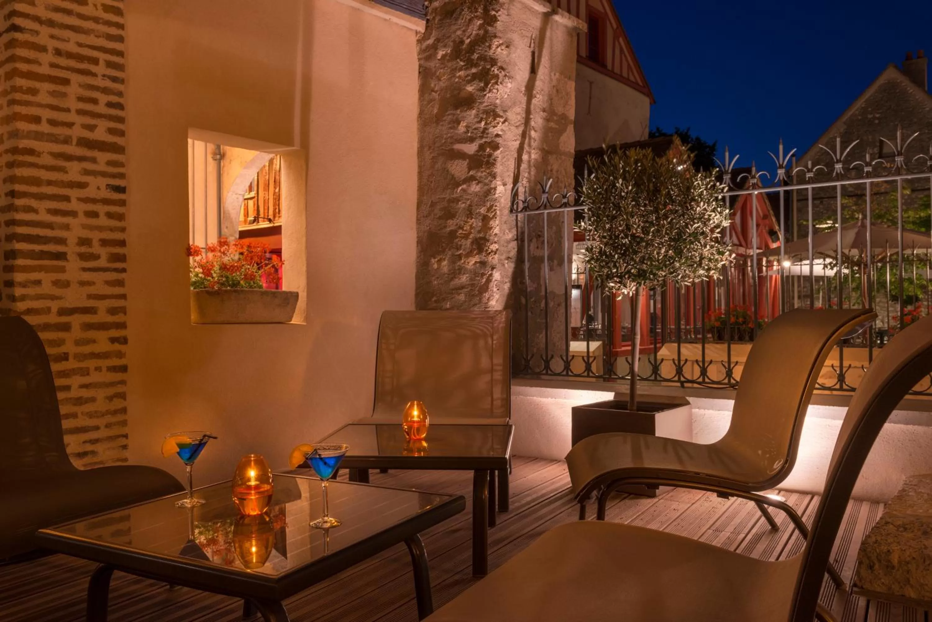 Patio in Hôtel Aux Vieux Remparts, The Originals Relais