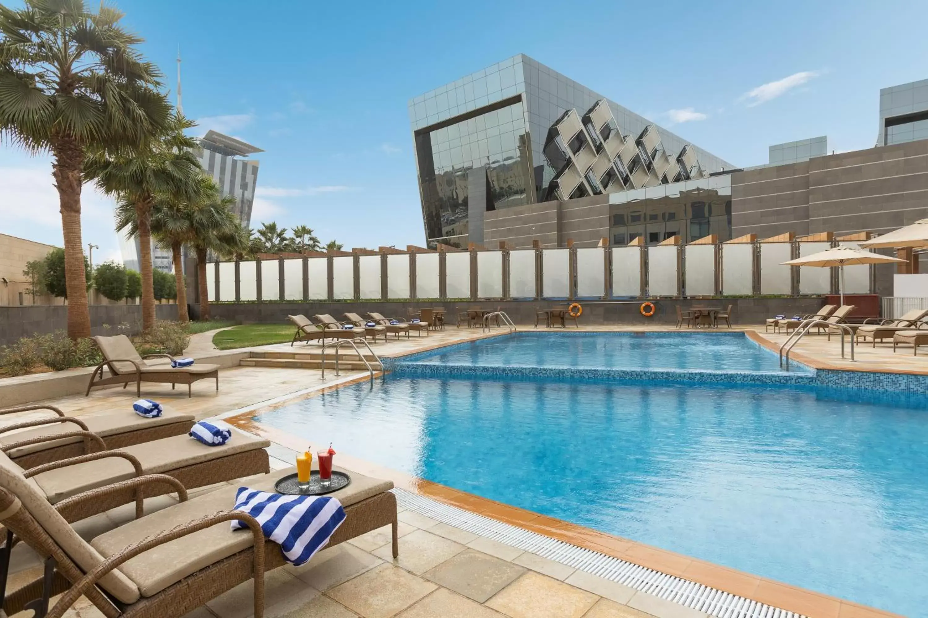 Property building, Swimming Pool in Crowne Plaza Riyadh - RDC Hotel & Convention, an IHG Hotel